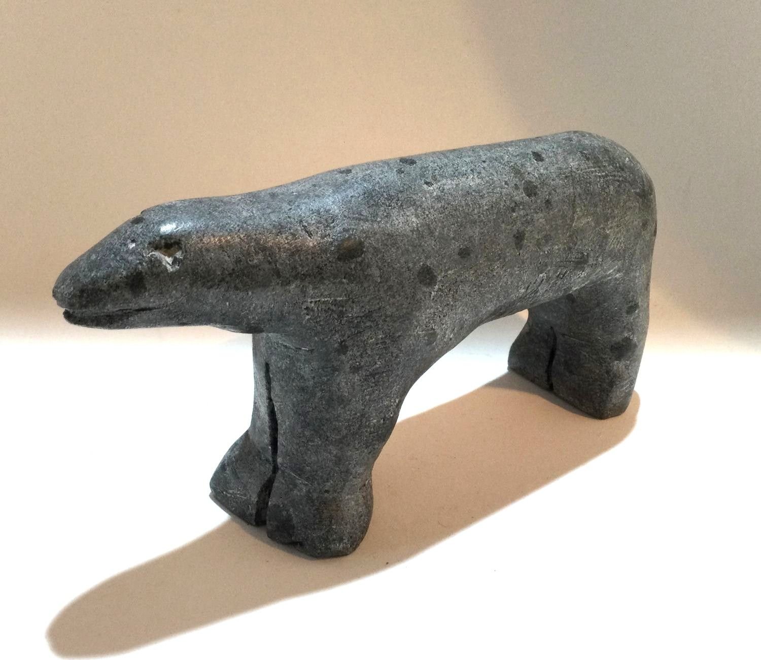 Eli Tikeayak E2-166 (1933-1995) Kangiqliniq/Rankin Inlet ᑲᖏᕿᓂᖅ, Little Grey Bear, n.d., serpentine, 3 x 5.5 x 1.75 inches (7.5 x 14 x 4.5 cm), provenance: private collection Saskatchewan, $750 Cdn.
