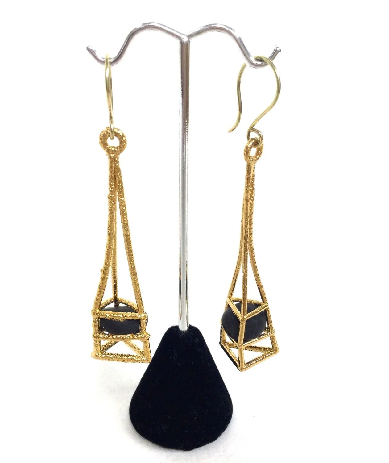 Cage Earrings C541 (#237), 2019, heavy 24K gold electroforming, lava pebbles, fusion welded stainless steel, electroformed copper, 2.5 x .5 x .5 inches (6.3 x 1.4 x 1.5 cm), $980 Cdn.