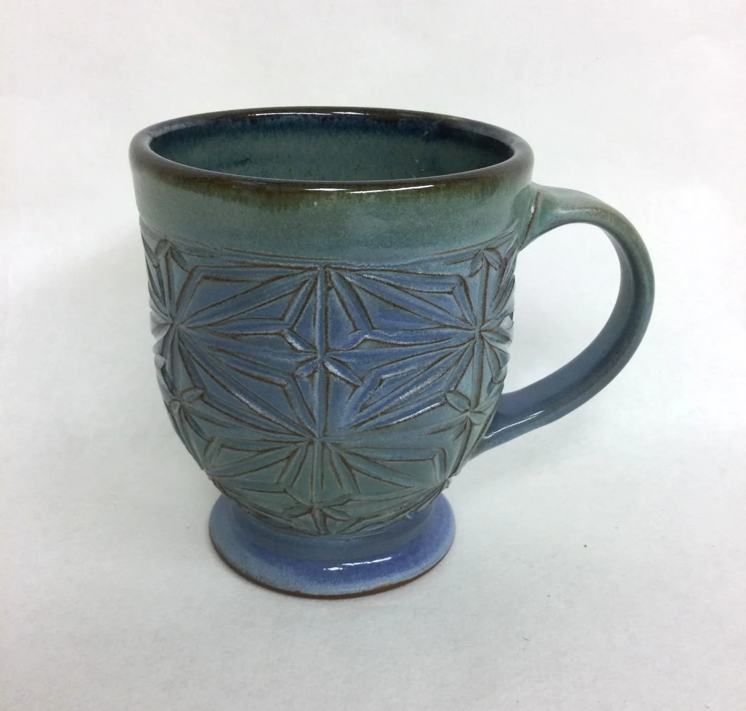 Kumiko Blue Sky Mug (#25.9.12), handcarved stoneware, 5 x 3.5 x 5 inches (13 x 9 x 13 cm), $50 Cdn.