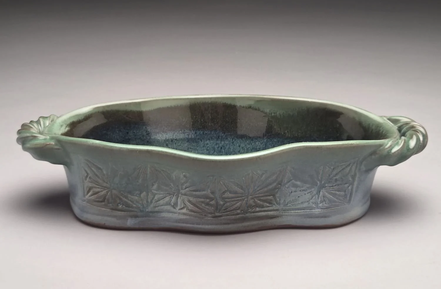 Kumiko Blue Skies & Prairie Water Dish (lge #26.5.11), 2026, hand carved & glazed stoneware, 2.5 x 5.75 x 11.25 inches (6.5 x 14.5 x 28.5 cm), $150 Cdn.