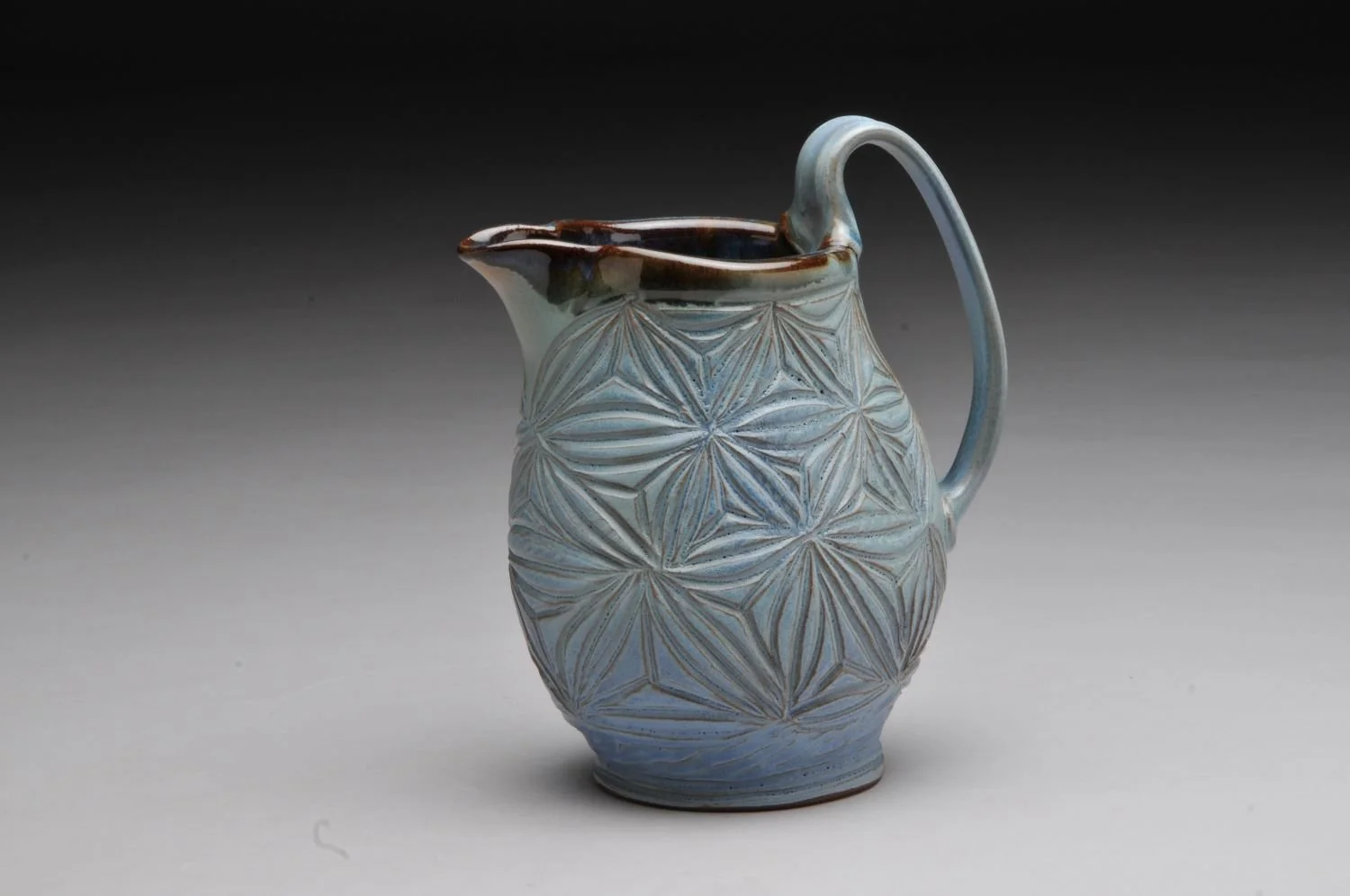 Kumiko Blue Sky Pitcher (#24.07.04), hand carved stoneware, 8 x 5 x 5 inches (20 x 13 x 13 cm), sold.