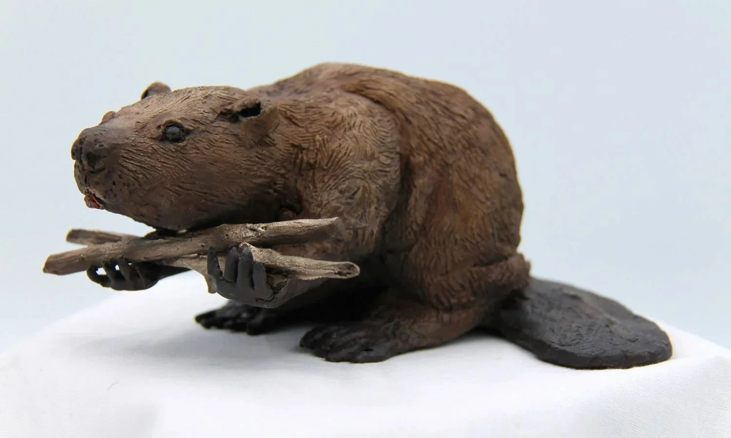 William (Beaver) Carrying Wood, 2024, ed. 1/9, patinated bronze, 3.5 x 7 x 6" (9 x 17.5 x 15 cm), $2050 Cdn.