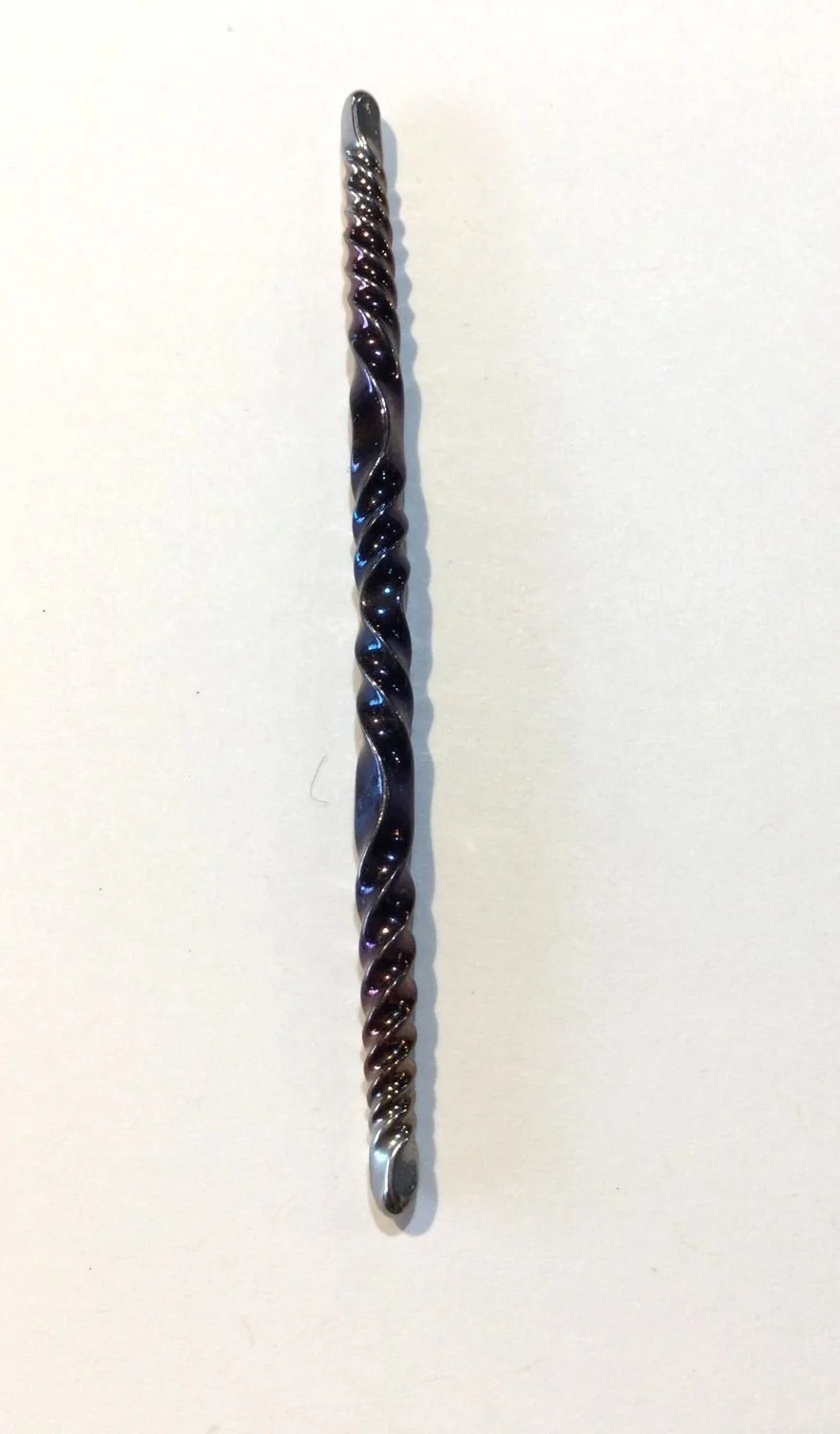 Quantum Wave Tie Pin (#0127C), 2025, steel, magnetic device, 3 x 0.15 x 0.15''/7.7 x 0.5 x 0.5cm (Including magnet: 3x0.5x0.25'' 7.7x1.5x1cm) (just magnet: 1.75x0.5'' 4.5x1.5cm), $200 Cdn....Note: The pin is secured by a magnet concealed behind the f