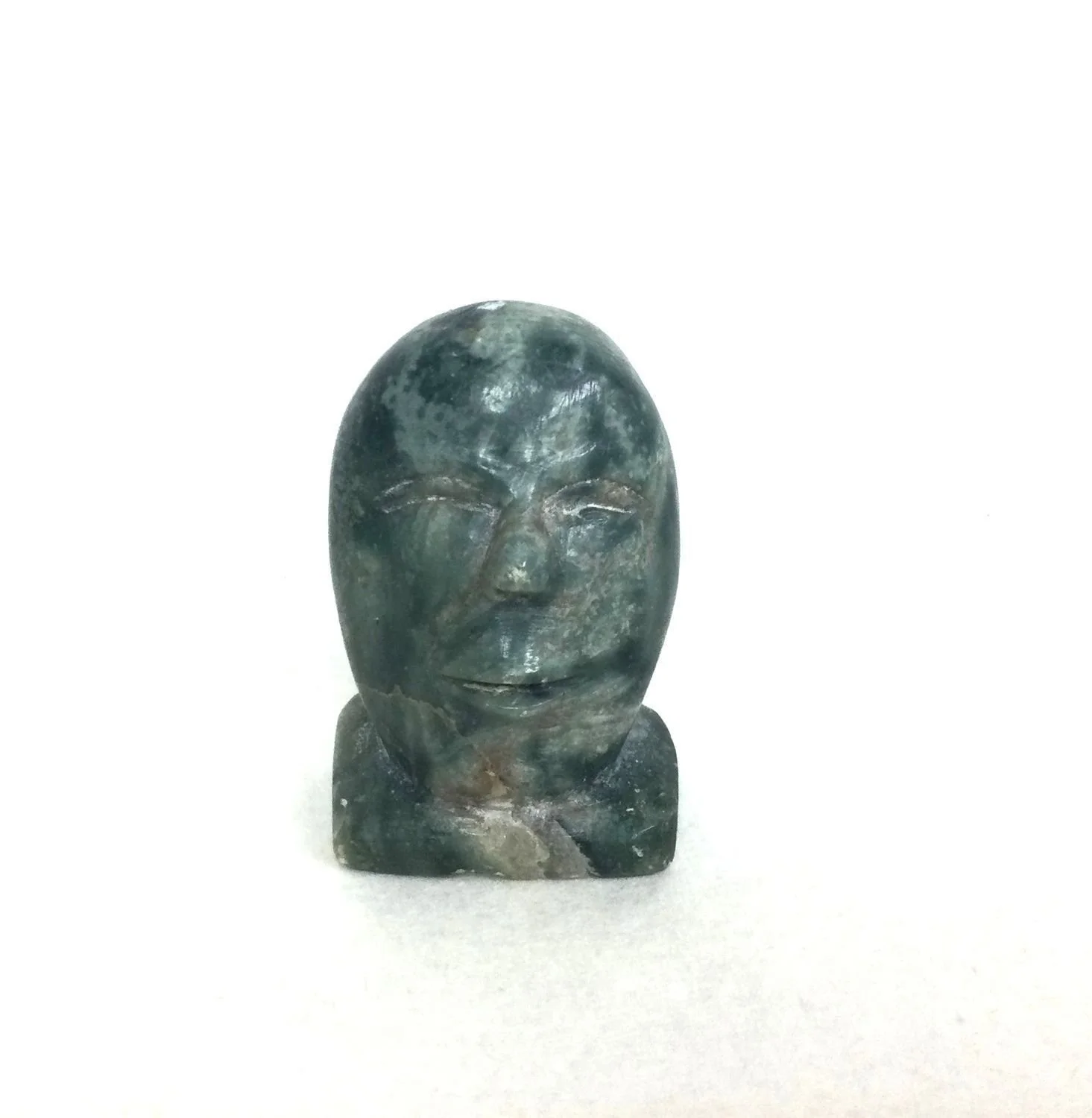 Peggy Ekagina ᐃᑲᒋᓇ, W2-290 (1919-93) Kugluktuk (Coppermine), Face (#26.1.1M), n.d., serpentine, 2 x 1.25 x .75 inches (5x3x2 cm), provenance: private collection Saskatchewan, $125 Cdn.