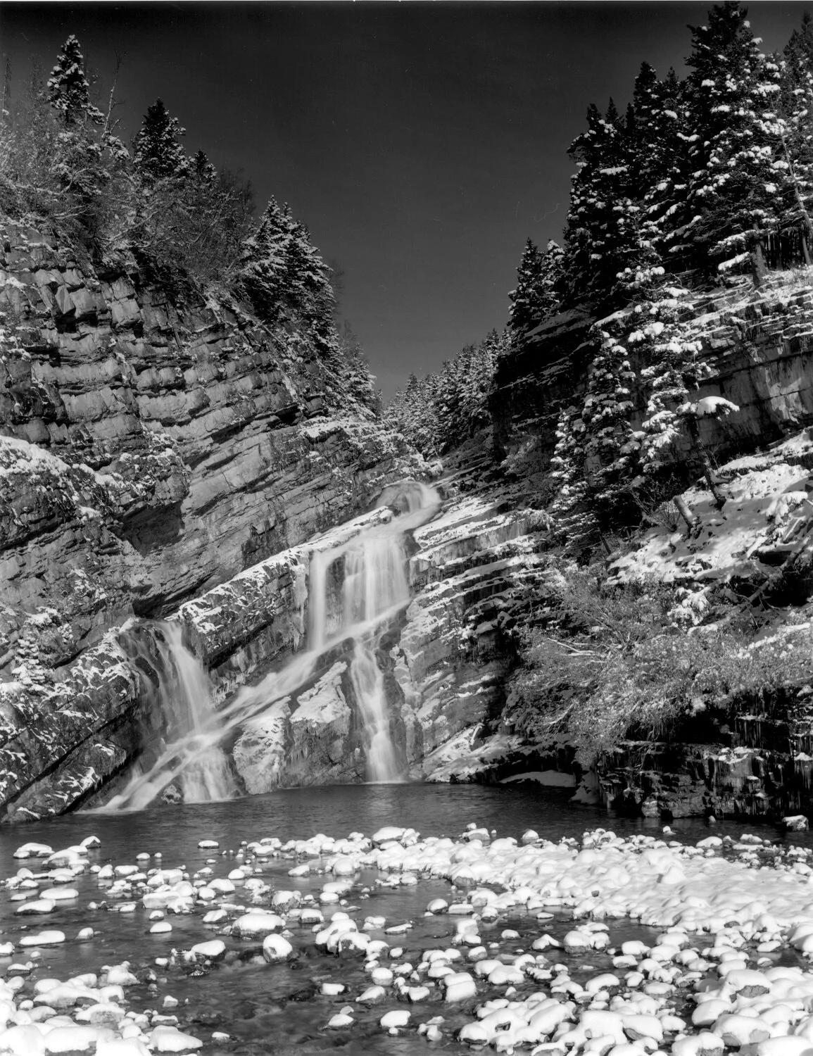 Cameron Falls, October Snowfall (cat#84), 2002, dark-room based selenium toned silver emulsion black & white photograph, framed, 24 x 20 inches (61x51 cm), ($3200 Cdn, category F); 20 x 16 inches (51 x 40.5 cm), ($2200 Cdn, category E).