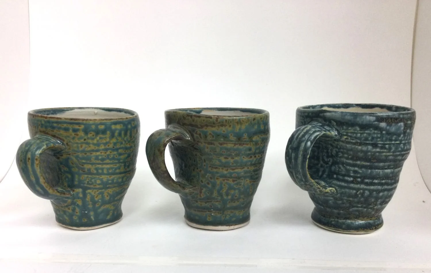 Reduction Fired Espresso Cups (#26.6.35ijk), 2026, reduction fired porcelain, 3.5 inches (9 cm) high, $35 Cdn each.
