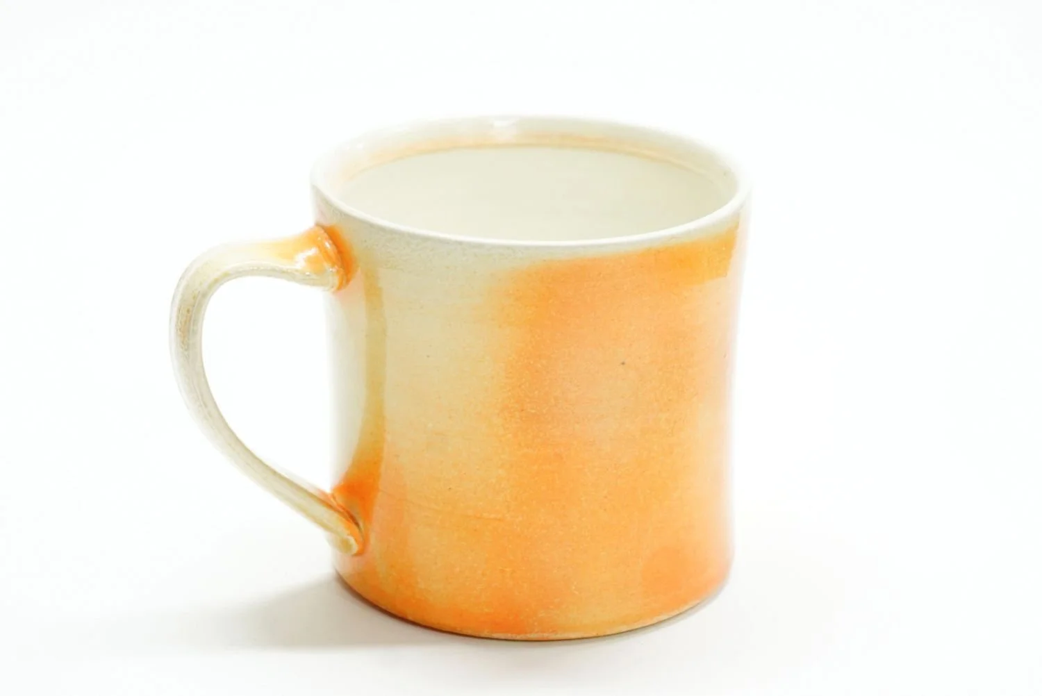 Soda Fired Mug (#25.43), 2025, soda fired porcelain, 3.5 x 5.5 x 3.75" (9 x 14 x 9.5cm) $50 Cdn