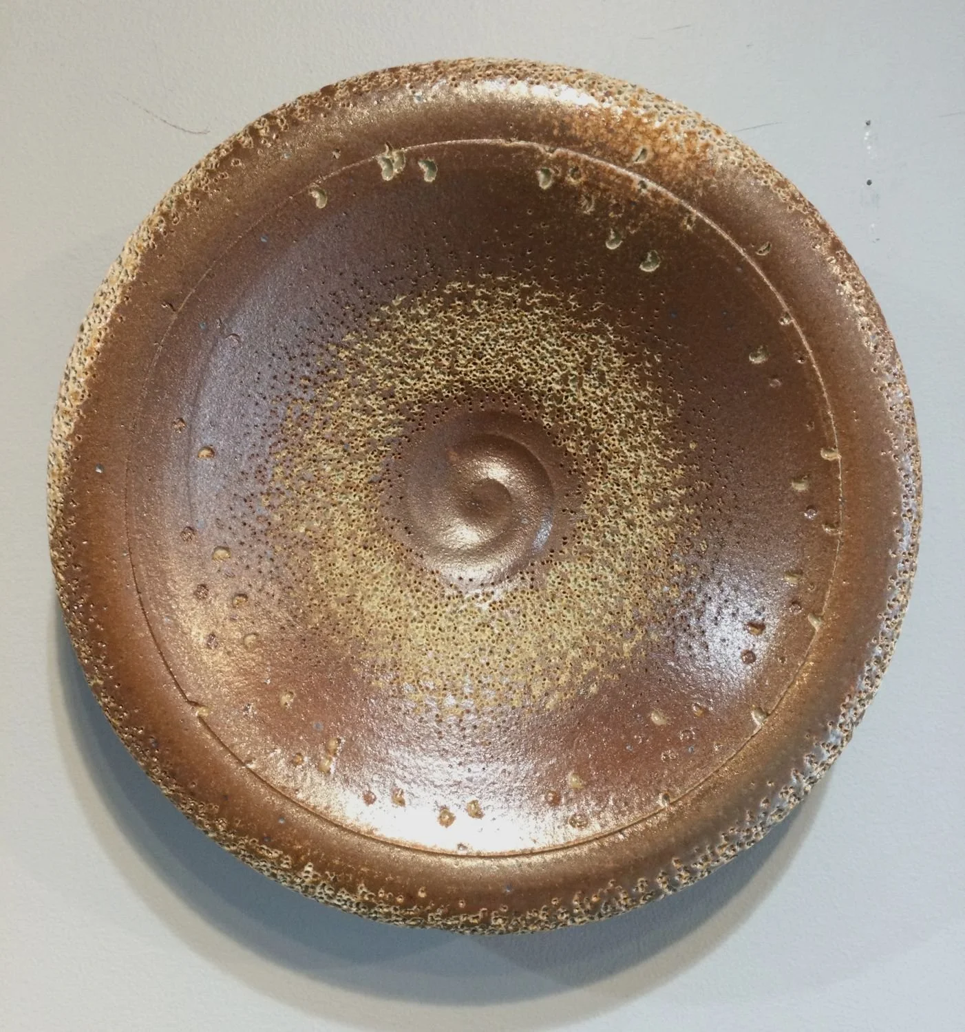 Textured Disc Wall Hanging Work (#26-3-10), 2025, soda-fired stoneware, 9 x 2.5 inches (23 x 6.5 cm), $200 Cdn.