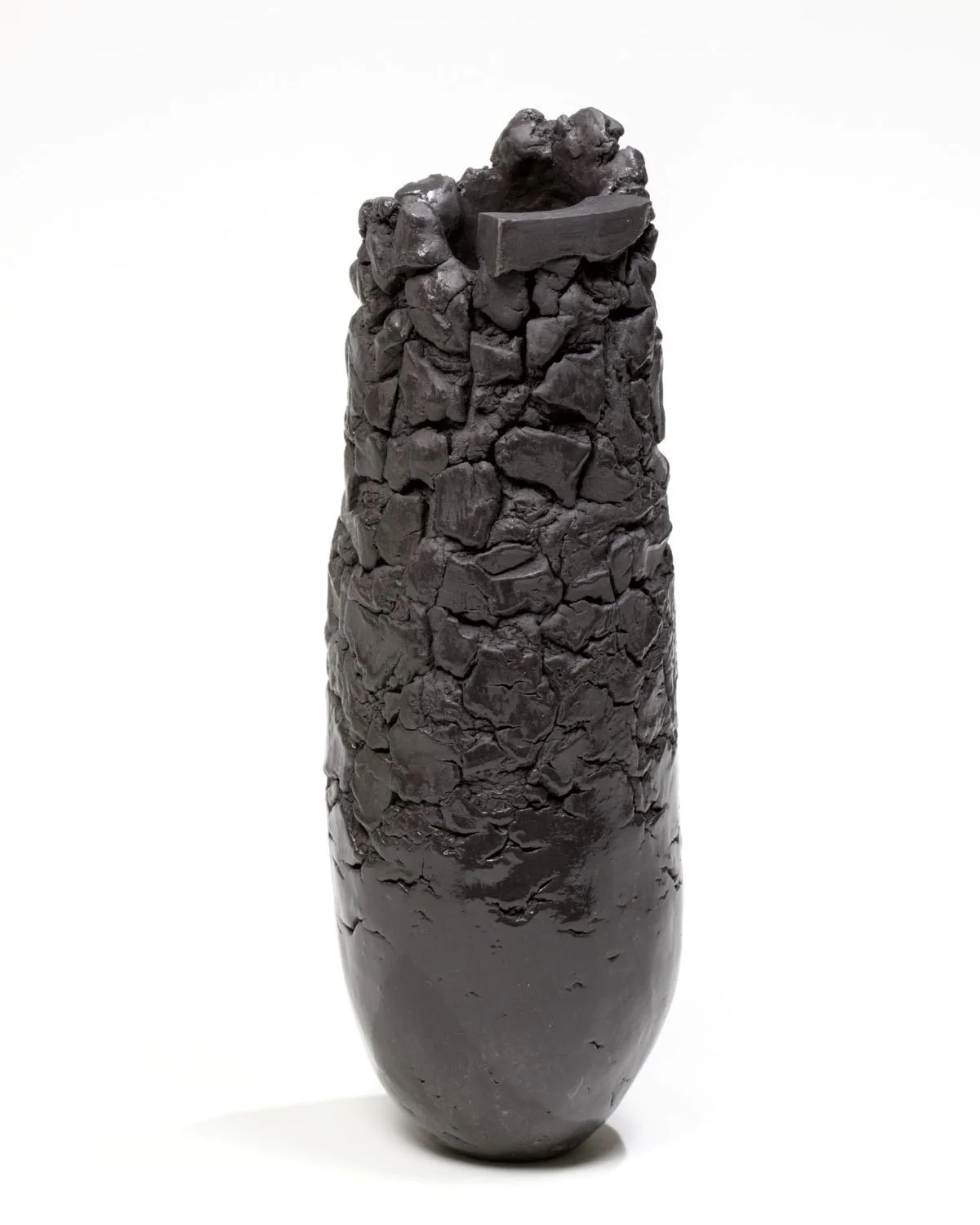 Architectural Detail Vessel (#25.8.12), 2025, hand-built, black porcelain, highly textured, clear glaze highlights, sold.