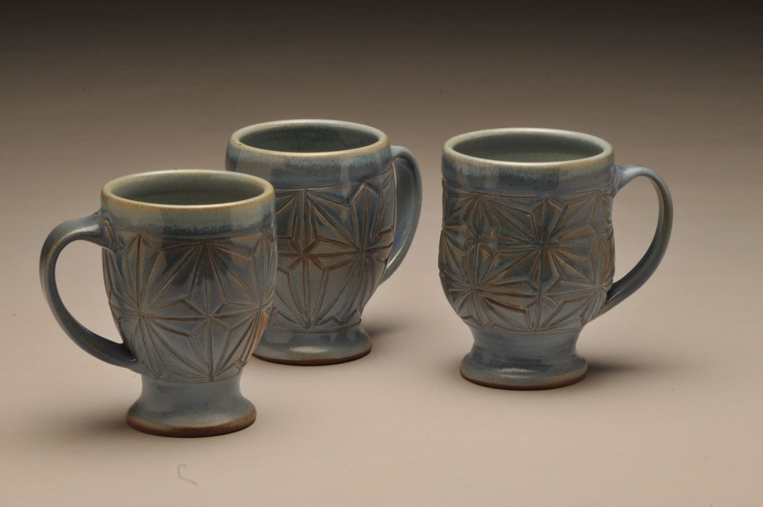 Kumiko Blue Sky Mugs #1, 8, 13, hand carved stoneware), 5 inches (13 cm) high, sold.
