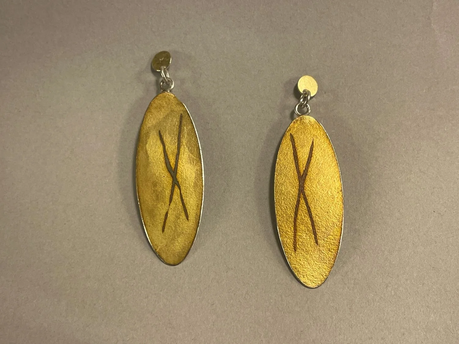 ‘Two Female Chromosomes’ Earrings (Swoop Series), 1980's, materials sterling 18k doublée, each (4.7 cm long), sold.