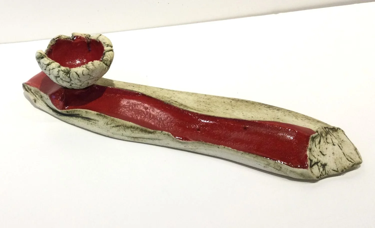 Free-Flowing Landscape Cup & Saucer, #25.18, 2025, stoneware, glaze, 3 x 12.5 x 4 inches (7.5 x 32 x 10 cm), $500 Cdn.