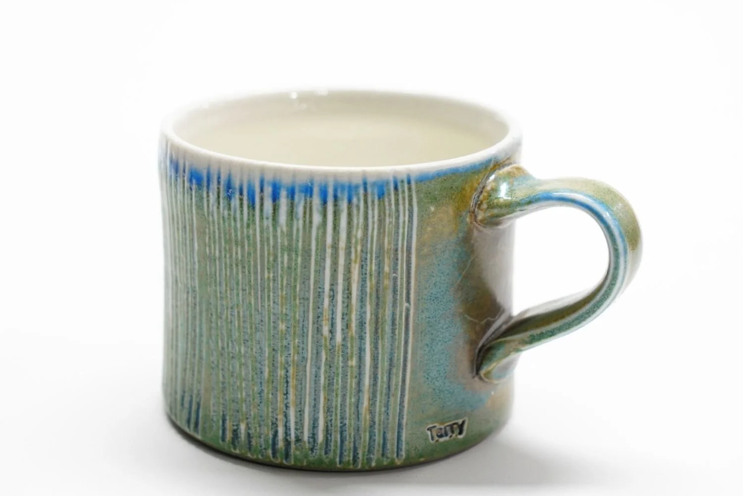 Espresso Cup (#25.66), 2025, soda fired porcelain, 2.25 x 3 x 4" (5.5 x 7.5 x 10 cm) $40 Cdn.