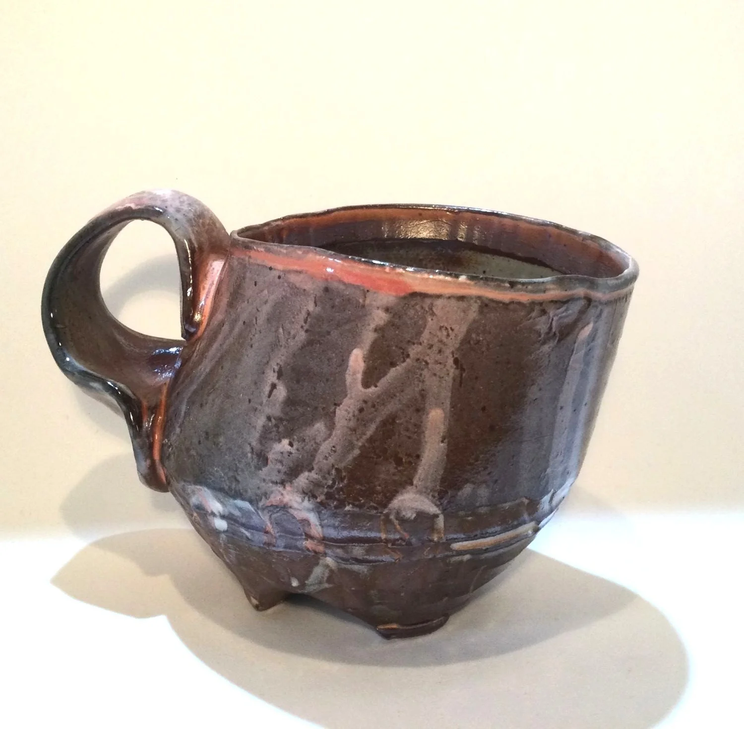 Confluence - Footed Mug (#26.2.80), 2026, low soda-fired earthenware, 3.75 x 5 x 3.5 inches (10 x 13 x 9 cm), $90 Cdn.