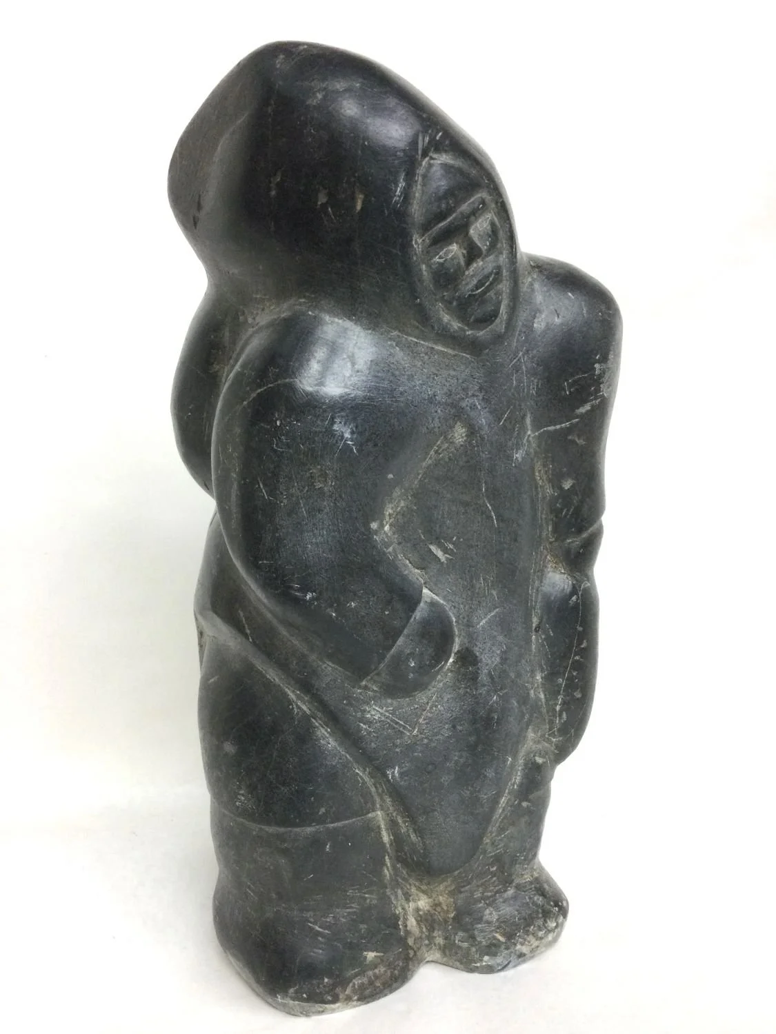 Barnabus Arnasungaaq (E2-213) ᐸᓇᐸᓯ ᐊᓇᓴᒐ (1924-2017) Qamani’tuaq / Baker Lake ᖃᒪᓂᑦᑐᐊᖅ, Standing Woman (#25.9.16), c.1970s, steatite/soapstone, 15.5 x 7.5 x 4.75 inches (39.5 x 19. x 12 cm), provenance: Vancouver collection, $12,000 Cdn.