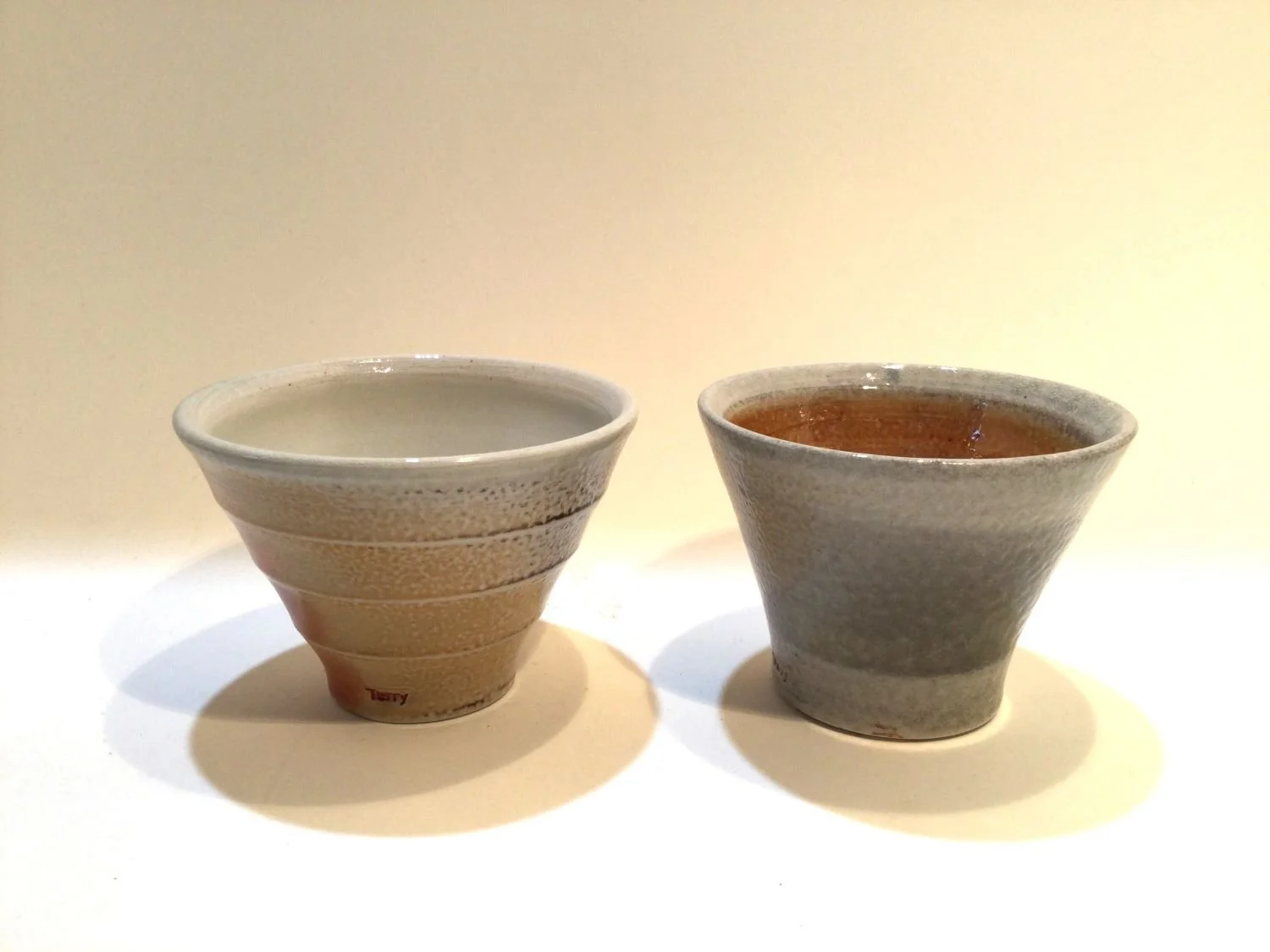 Shot Glasses (#26.7.4de), 2026, soda fired porcelain, 2.25 x 3 inches (5.5 x 7.5 cm), $25 Cdn each