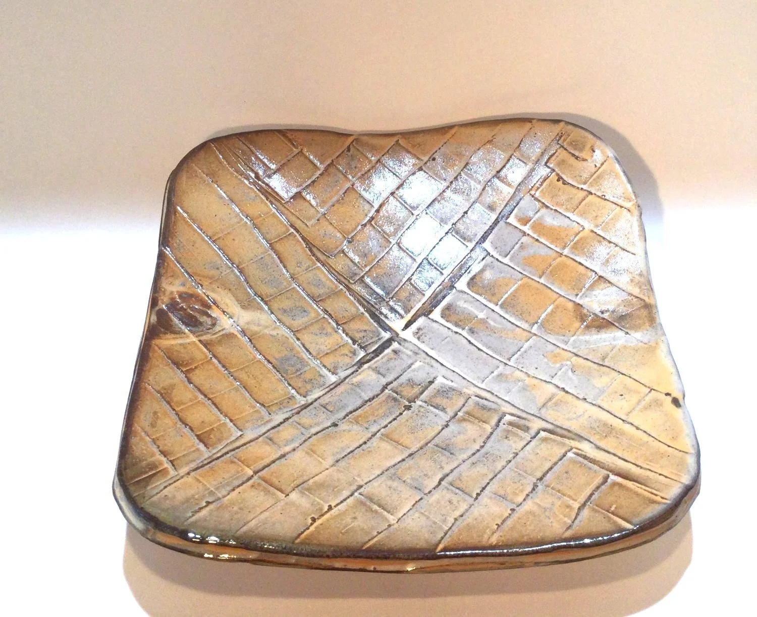 Confluence - Square Plate (#26.2.51), 2026, low soda-fired earthenware, 1.75 x 7 x 7 inches (4 x 17.5 x 17.5 cm), $80 Cdn.