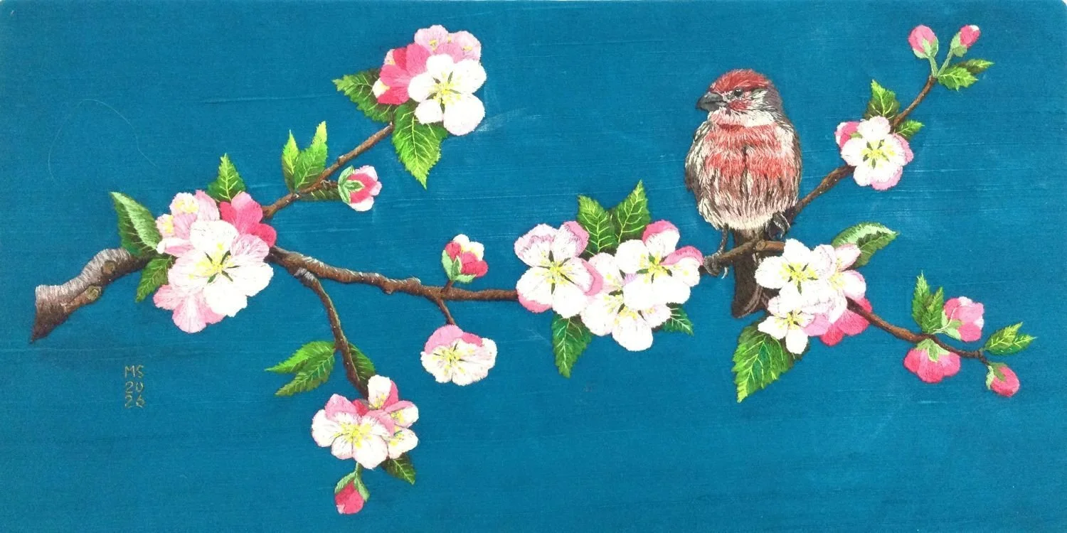 House Finch And Apple Blossoms, 2026, hand embroidery, silk-shading, cotton thread on silk dupioni ground, 8.25 x 16.25 inches (20.5 x 42 cm), framed, $3300 Cdn.