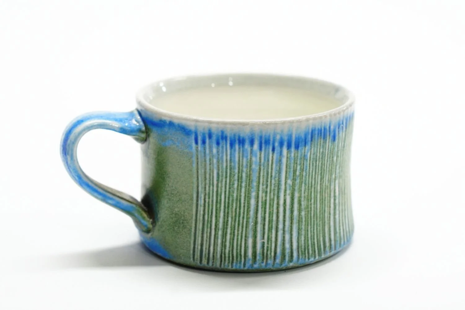 Espresso Cup (#25.65), 2025, soda fired porcelain, 2.25 x 3 x 4" (5.5 x 7.5 x 10 cm) sold