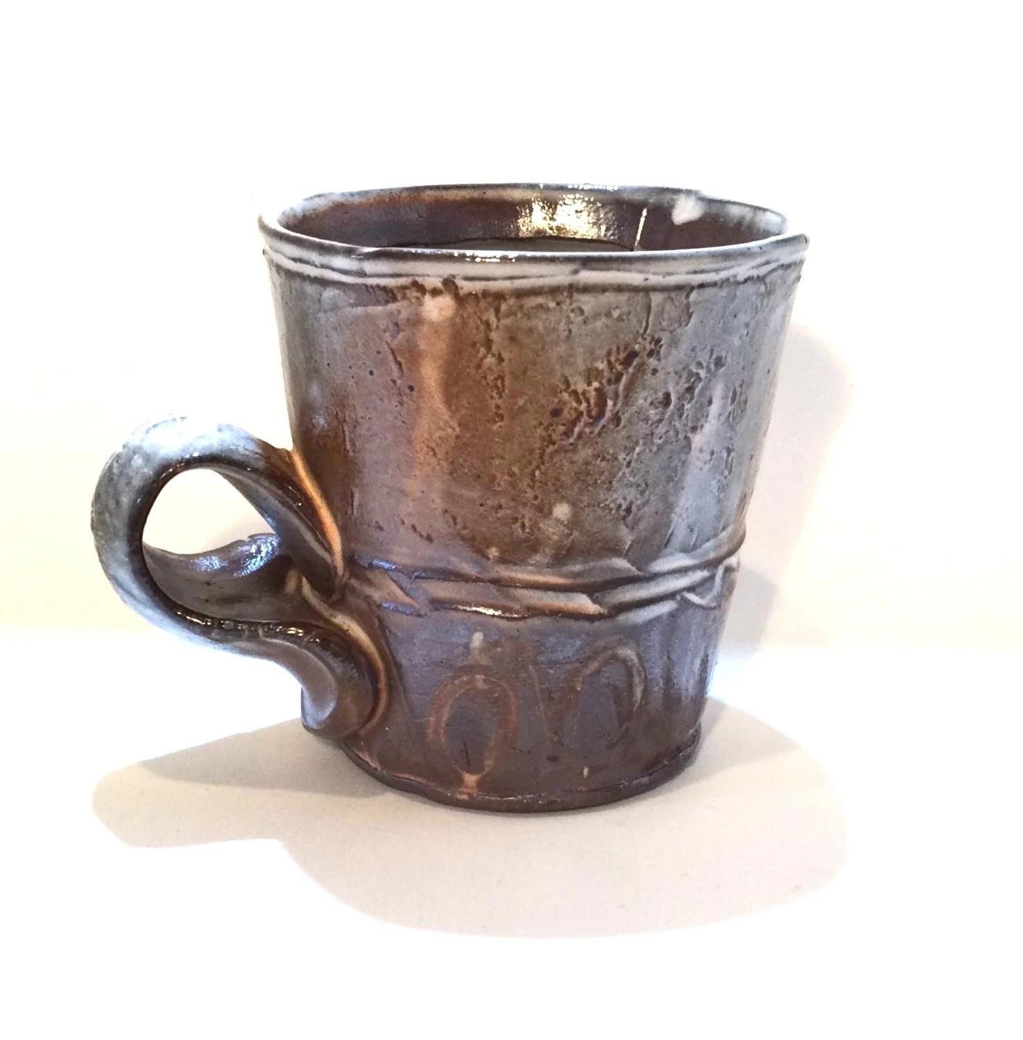 Confluence - Espresso Mug (#26.2.73), 2026, low soda-fired earthenware, 3.25 x 4.25 x 3.25 inches (8.5 x 11 x 8 cm), $60 Cdn.