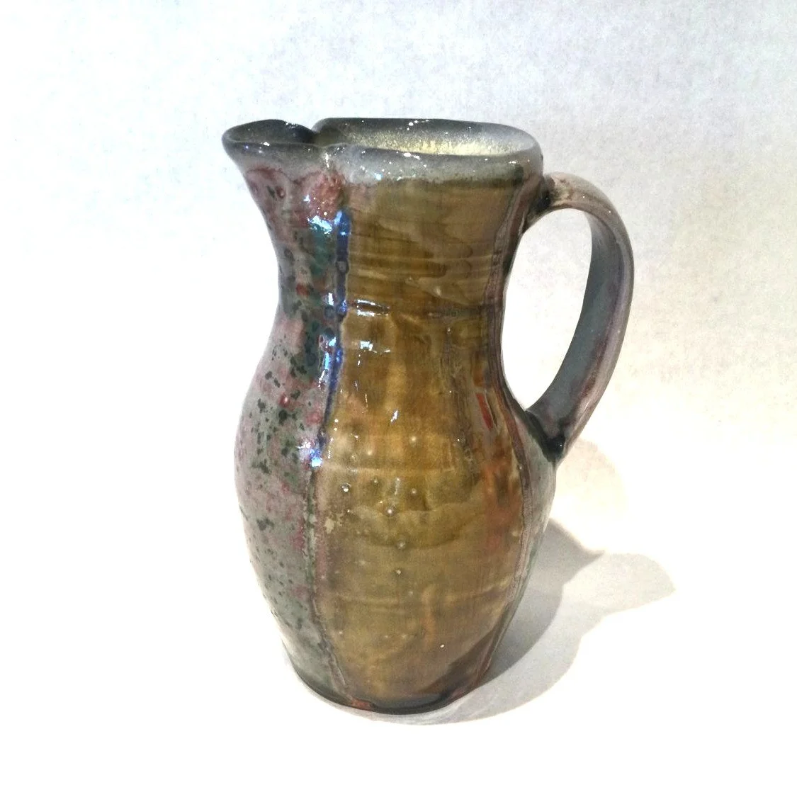 Toward Copper Red Pitcher (#25.7.1), 2025, porcelain, 7.5 x 5.5 x 4.25 inches ( 18.5 x 14 x 11 cm), $75 Cdn.