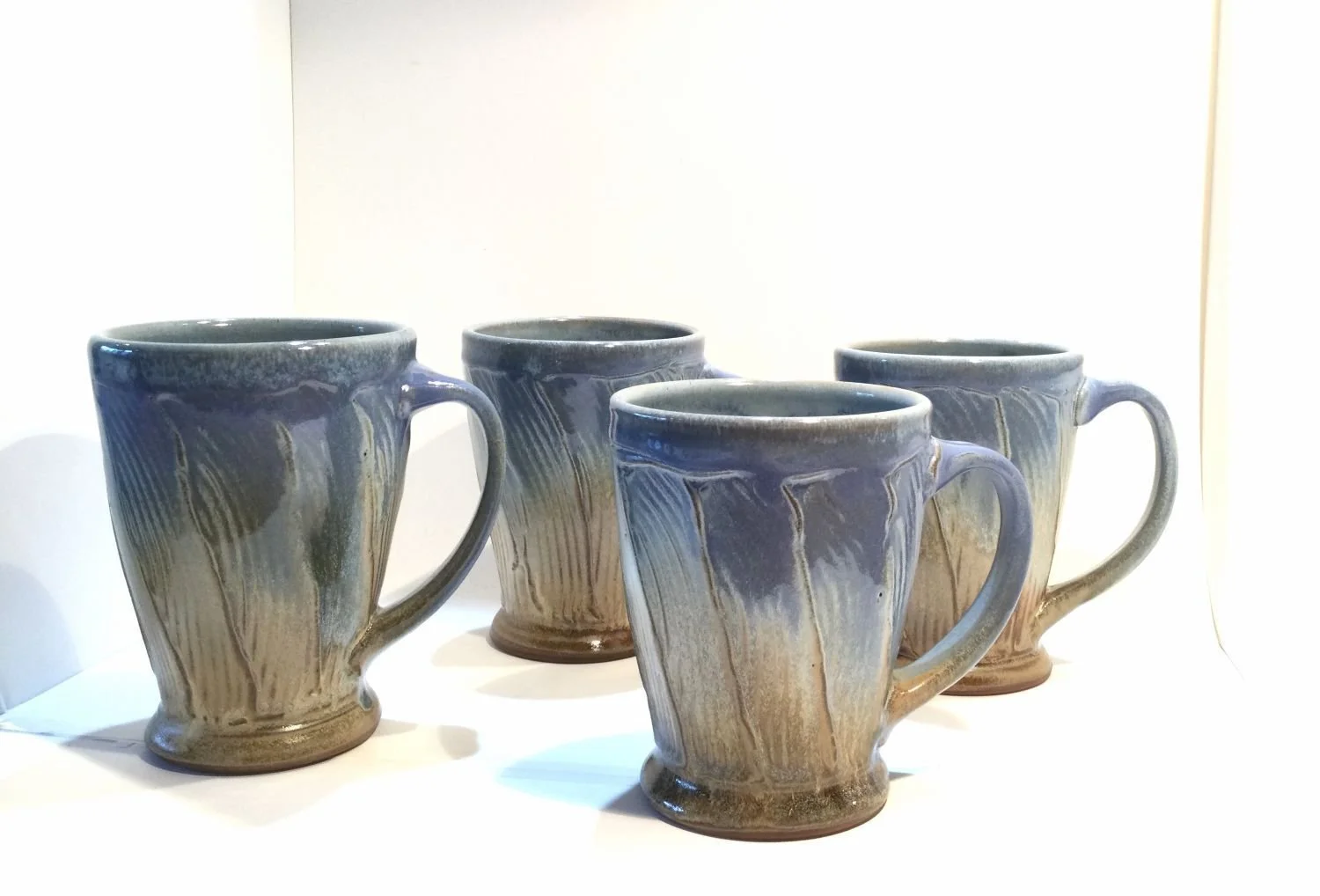 Blue Skies & Prairie Mugs (#26.18cf), 2026, glazed stoneware, 5 x 5 x 3.5 inches (12.5 x 12.5 x 9 cm), $65 Cdn each