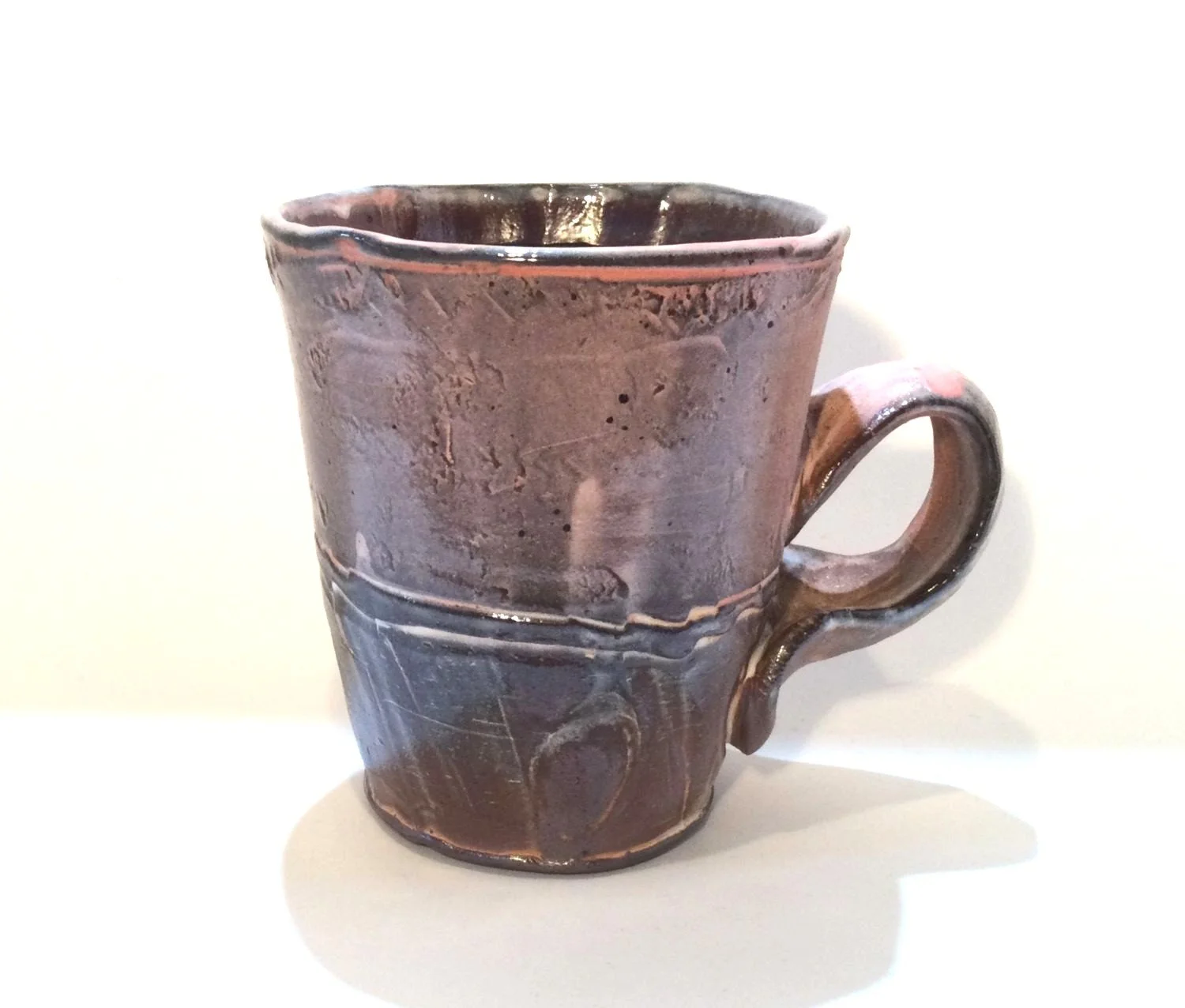 Confluence - Straight Mug (#26.2.66), 2026, low soda-fired earthenware, 4.25 x 4.75 x 3.25 inches (11 x 12 x 9 cm), $85 Cdn.