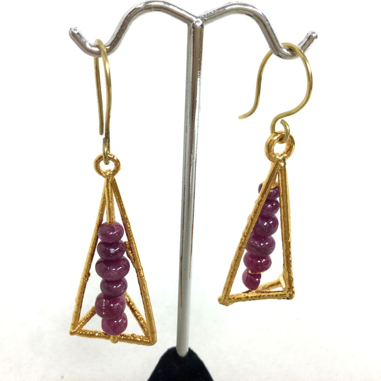 Pagoda Cage Earring (#269), 2018, thick electroformed 24k gold, rubies, 18k gold ear wire, fusion welded stainless steel, electroformed copper, 2.25 x .75 inches (5.5 x 2  cm), $1260 Cdn.