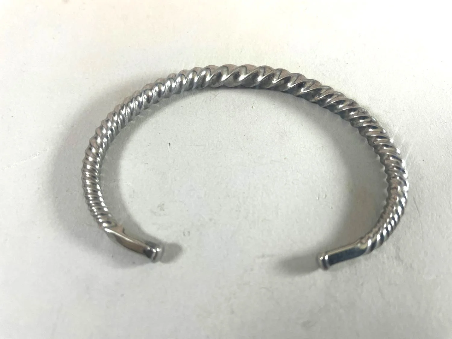 Quantum Wave Bracelet (#244A), 2024, twisted steel, 2.913 x 1.969 x 0.118 inches (7.4 x 5 x 0.3cm), $420 Cdn.
