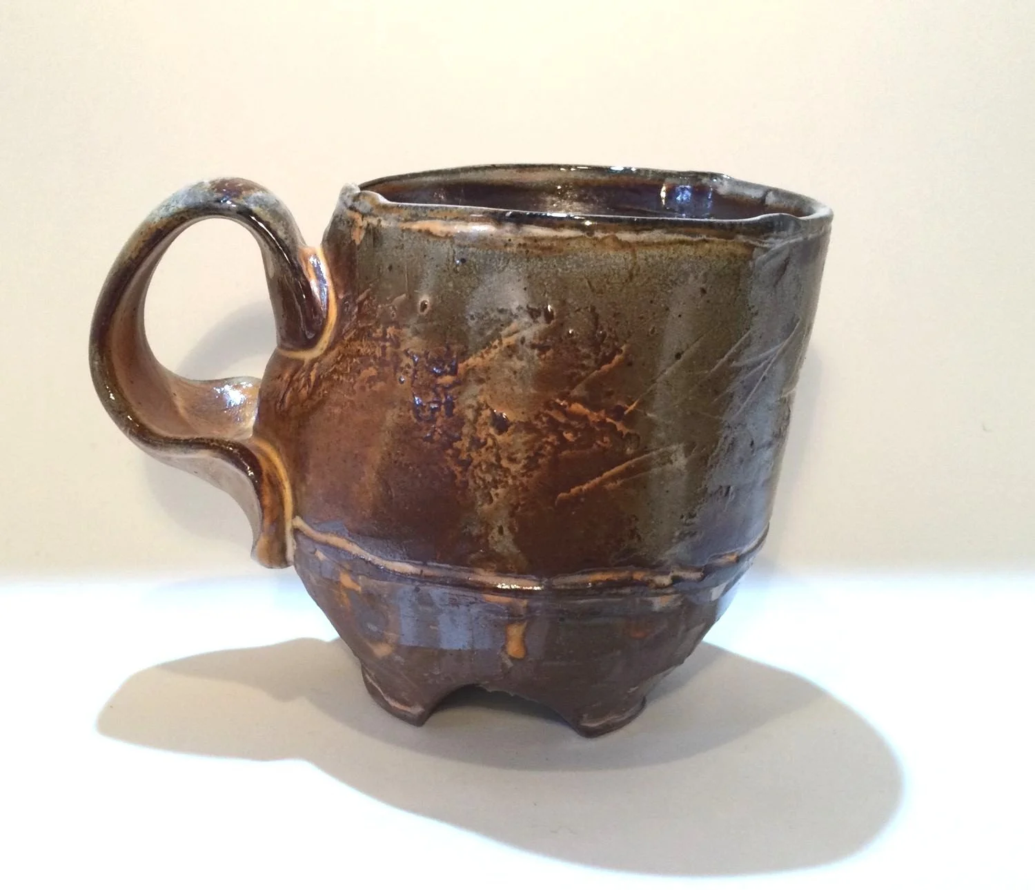 Confluence - Footed Mug (#26.2.86), 2026, low soda-fired earthenware, 3.75 x 5 x 3.5 inches (10 x 13 x 9 cm), $90 Cdn.