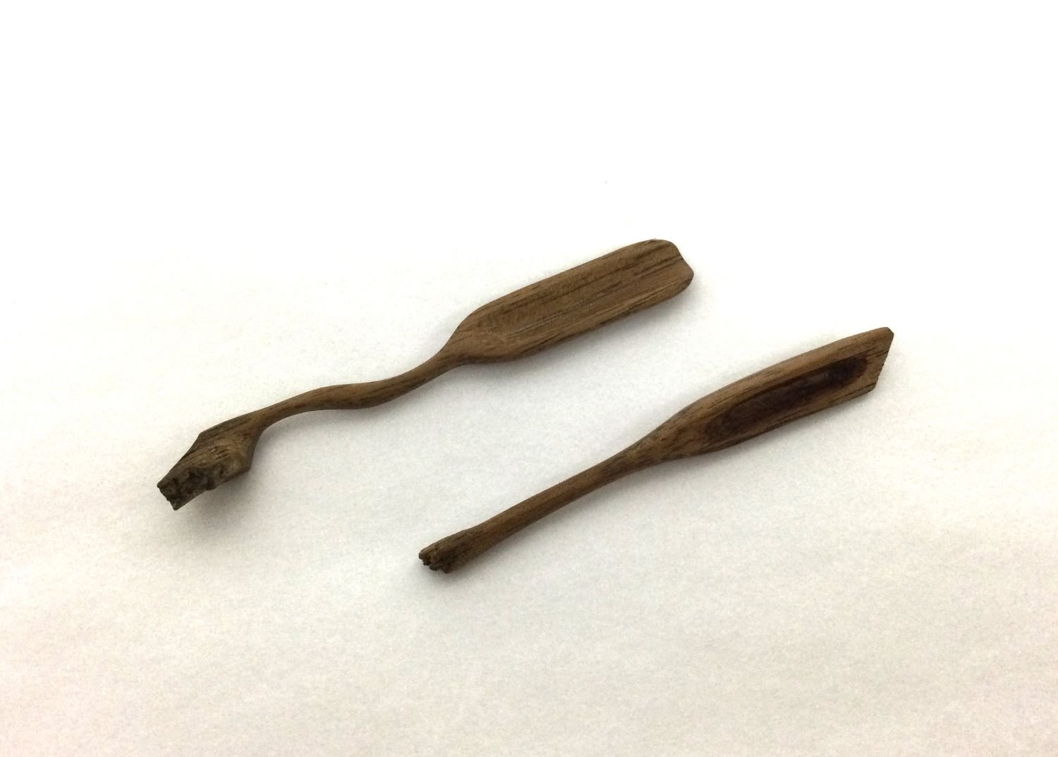 Tiny Spoons (24.2a & b), chiselled & hand sanded walnut, 2.25 x .25 x 1/8 inches (6 x .5 x .25 cm), sold.