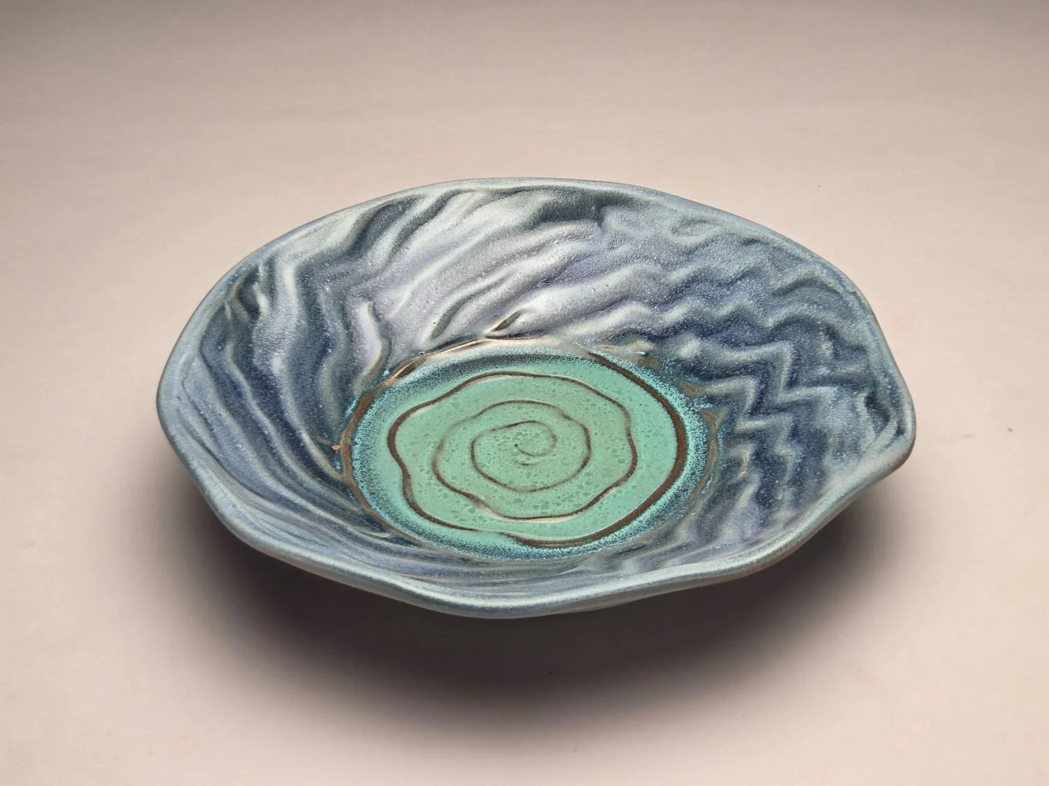 Whirlpool & Blue Sky Plate (#26.5.8), 2026, glazed stoneware, 2 x 9 x 9 inches (5 x 23 x 23 cm), $110 Cdn.
