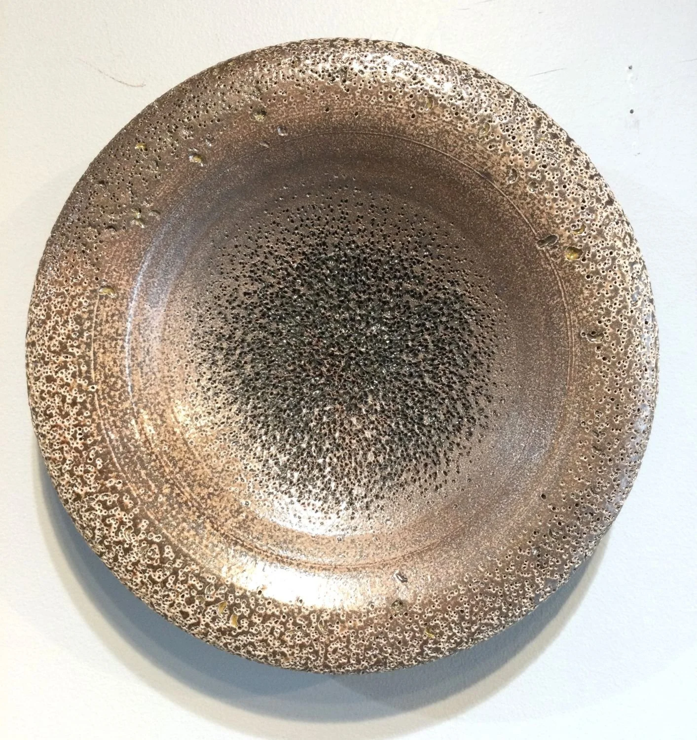 Textured Disc Wall Hanging Work (#26-3-11), 2025, soda-fired stoneware, 9 x 2.5 inches (23 x 6.5 cm), $200 Cdn.