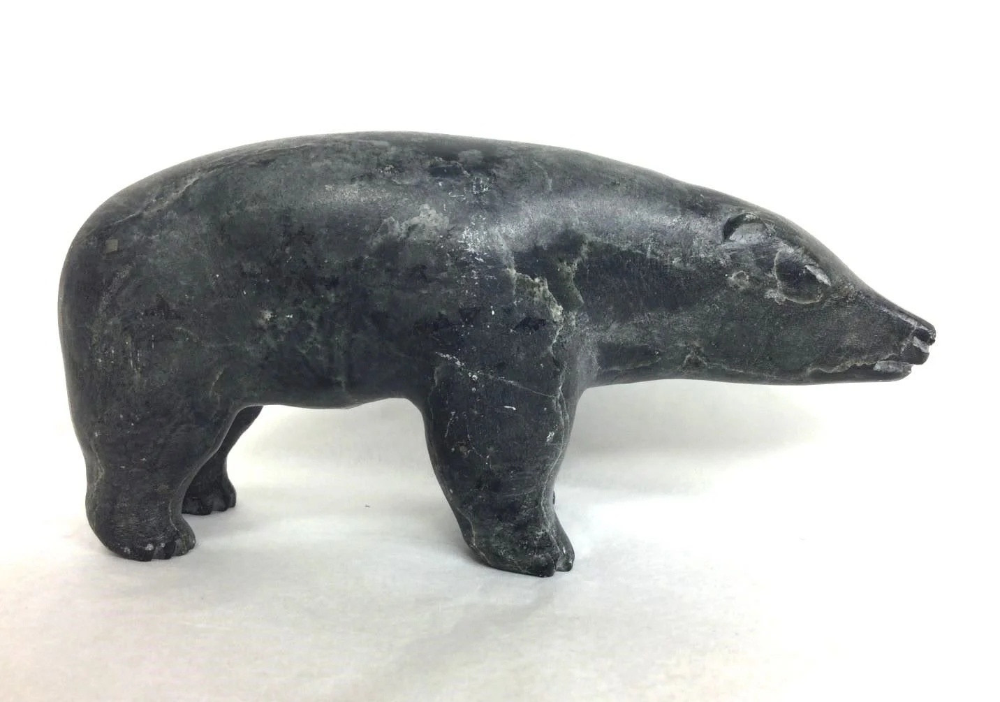 artist unknown (Kugluktuk/Coppermine, ᖁᕐᓗᖅᑐᖅ), Bear, n.d., steatite (soapstone), 3.25 x 2 x 6.25 inches (8.25 x 5 x 16 cm), provenance: private collection BC, sold.