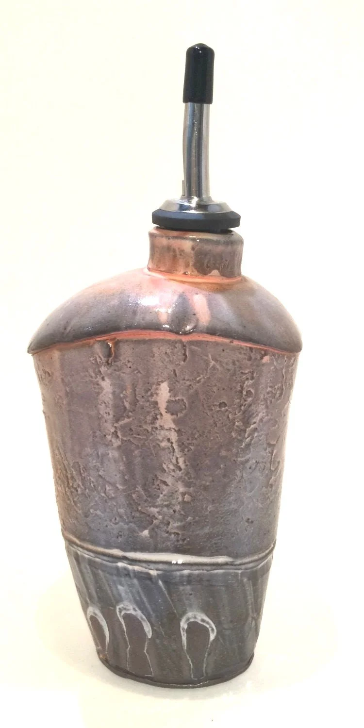 Confluence - Oil Bottle (#26-2-32), 2026, low soda fired earthenware, 8.75 x 3 x 4 inches (22.5 x 8 x 10 cm), sold.