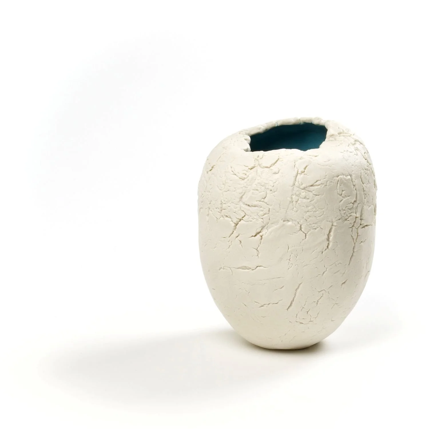 Robin's Egg Blue Vase (#25.8.8), 2025, pinched porcelain, textured, unglazed exterior with blue interior, 5 x 4 inches (12.7 x 10.2 cm), $175 Cdn.