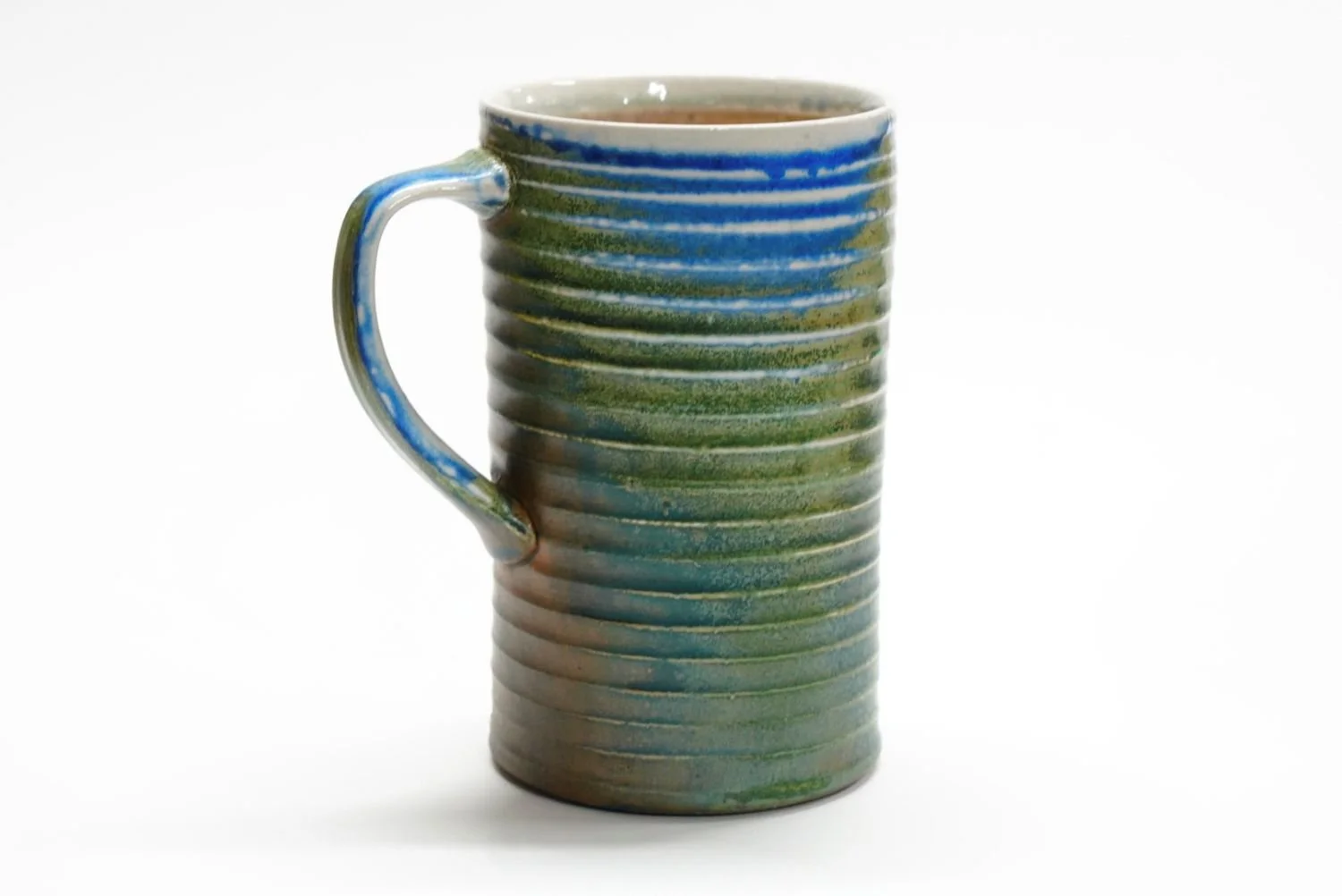 Tall BeeHive Blue/Green Mug (#25.60), soda fired porcelain, 6 x 4.75 x 3.5 inches (15 x 12 x 9cm), $55 Cdn.