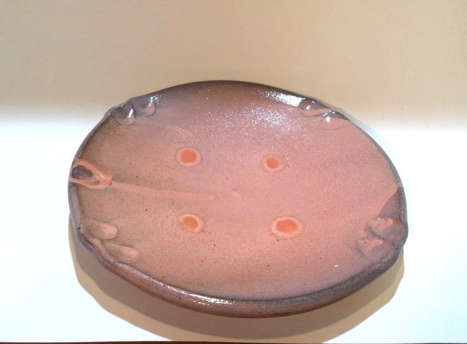 Confluence Side Plate (#26.2.47), 2026, low soda-fired earthenware, 1.25 x 7.5 x 7.5  inches (3 x 19 x 19 cm), $80 Cdn.