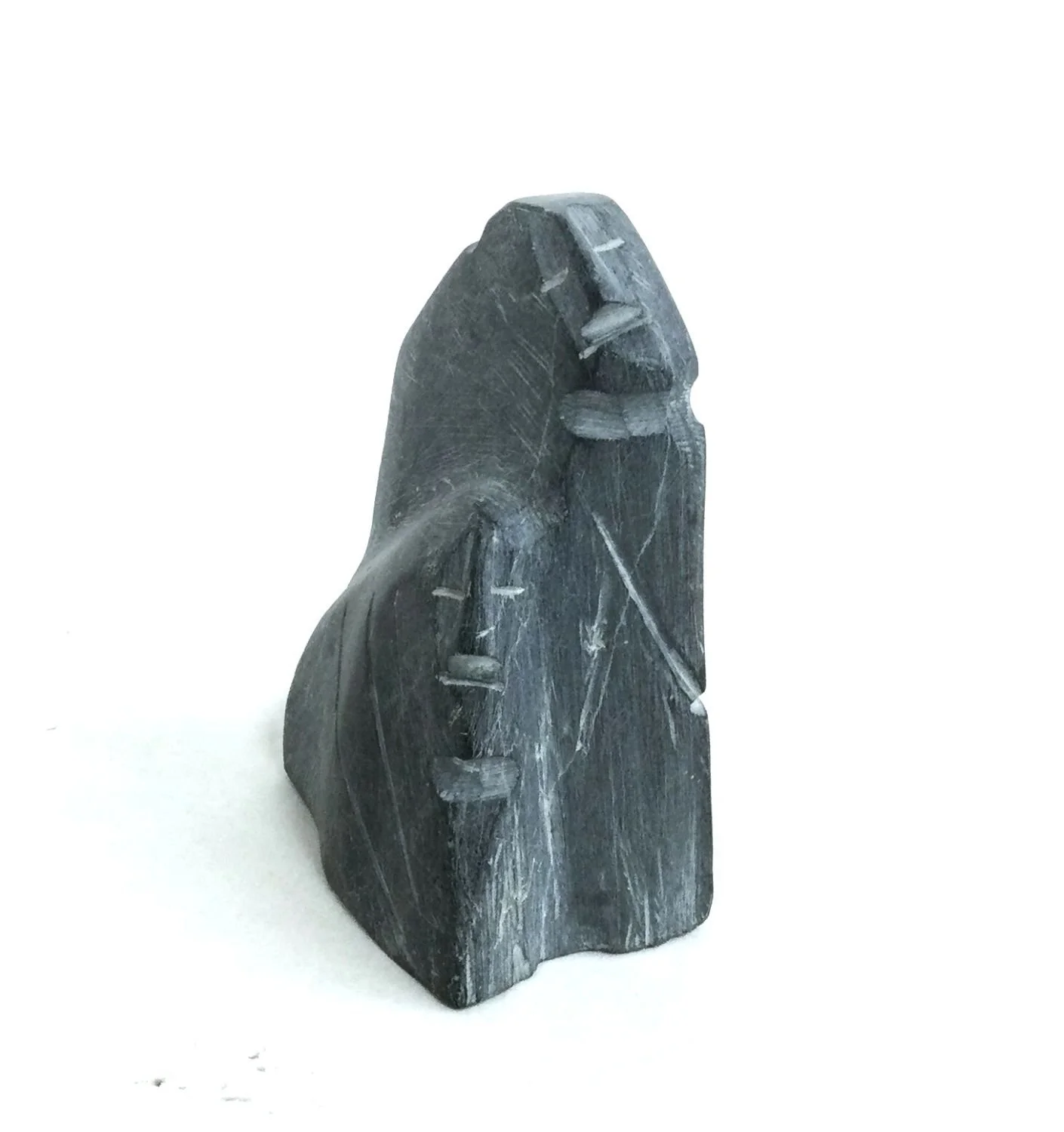 Lucy Tasseor Tutsweetok ᓗᓯ ᑕᓯᐅ ᑎᓯᑕ (1934-2012) Arviat/Eskimo Point ᐊᕐᕕᐊᑦ, Family Group (#25.8.6), c.1975, argillite, 4 x 2 x 3 inches (10 x 7 x 4 cm), provenance: private collection Canmore, $1500 Cdn.