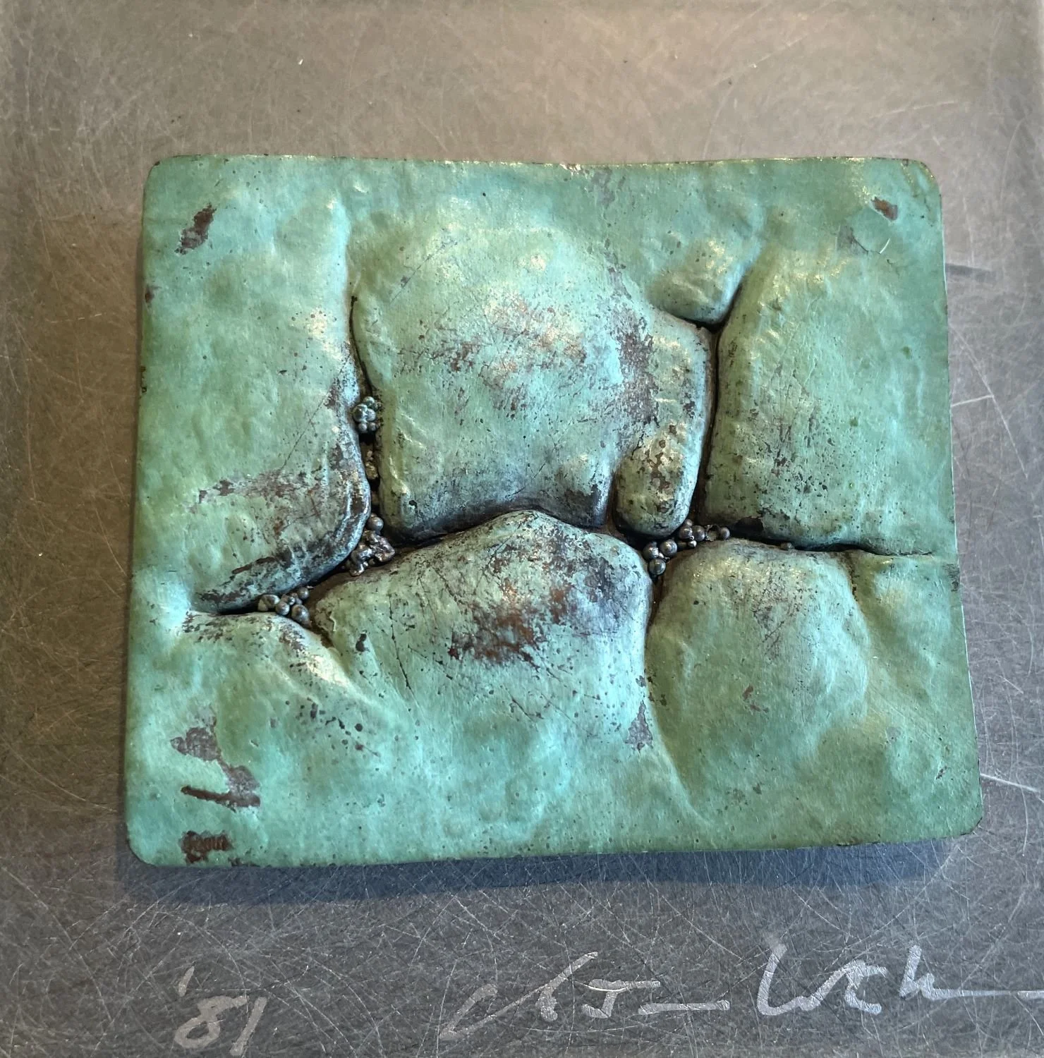 ‘Chased Landscape’ Wallpiece, 1981, copper, stone, sterling silver (chased and patinated, granulation), 3.5 x 3.5 x 1.25 inches (8.9x8.9x3.2cm), sold.