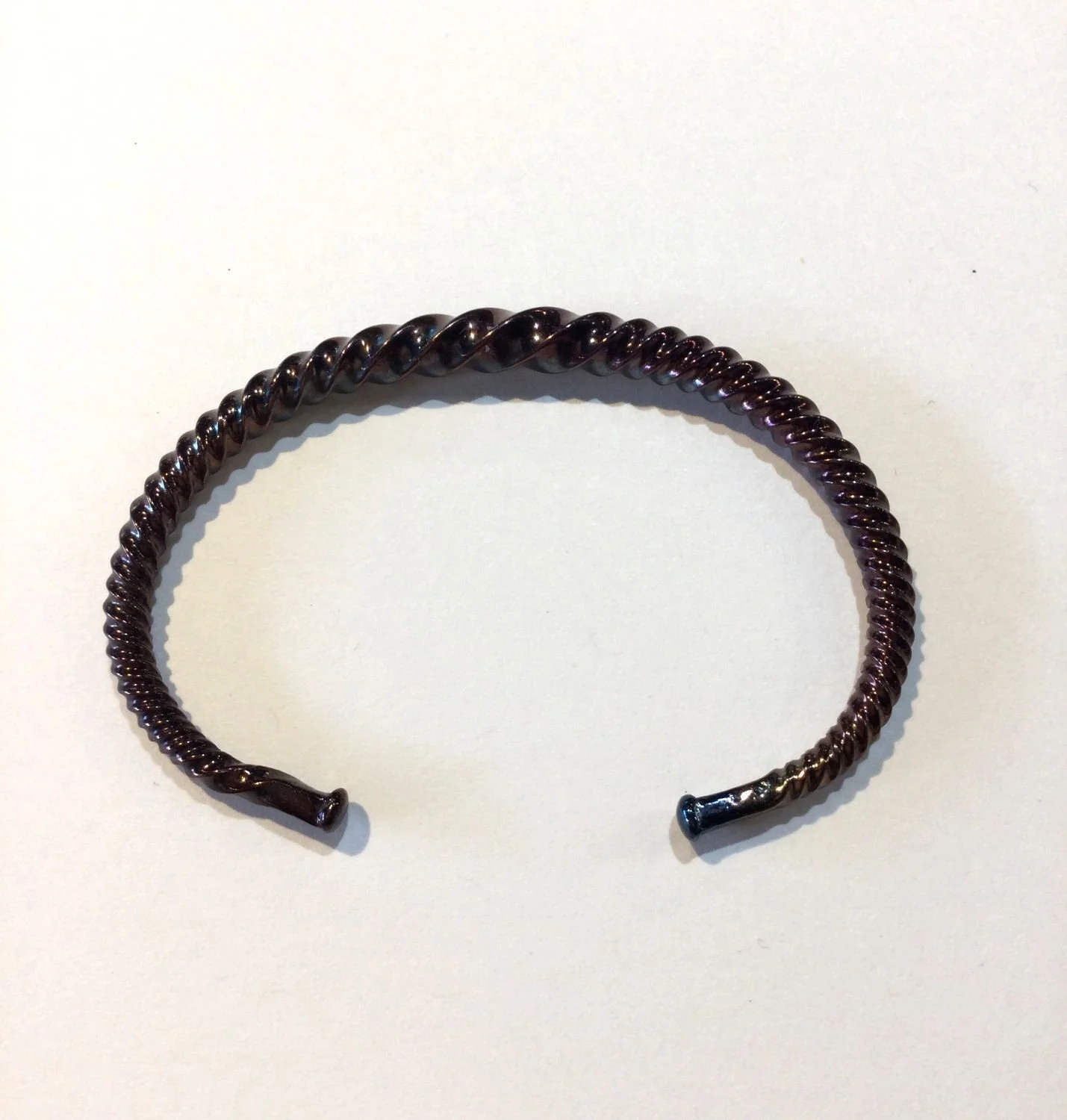 Quantum Wave Bracelet (#244B), 2024, twisted steel, 2.913 x 1.969 x 0.118 inches (7.4 x 5 x 0.3cm), $420 Cdn.
