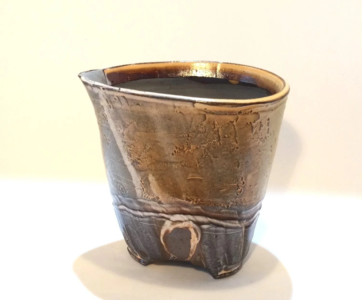 Confluence - Creamer (#26.2.56), 2026, low soda-fired earthenware, 4 x 4.25 x 3.25 inches (10 x 11 x 8 cm), $80 Cdn.