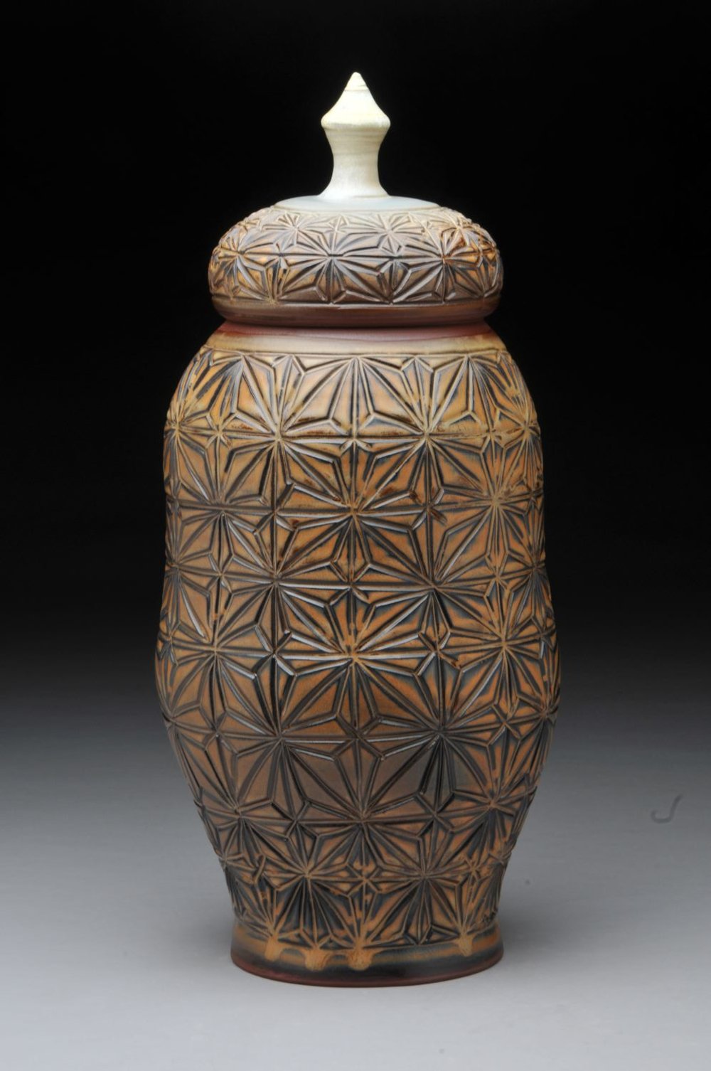 Kumiko Prairie Fields Storage Jar (#2), hand carved, glazed stoneware, 16.5 x 7 inches (42 x 18 cm, $350 Cdn.