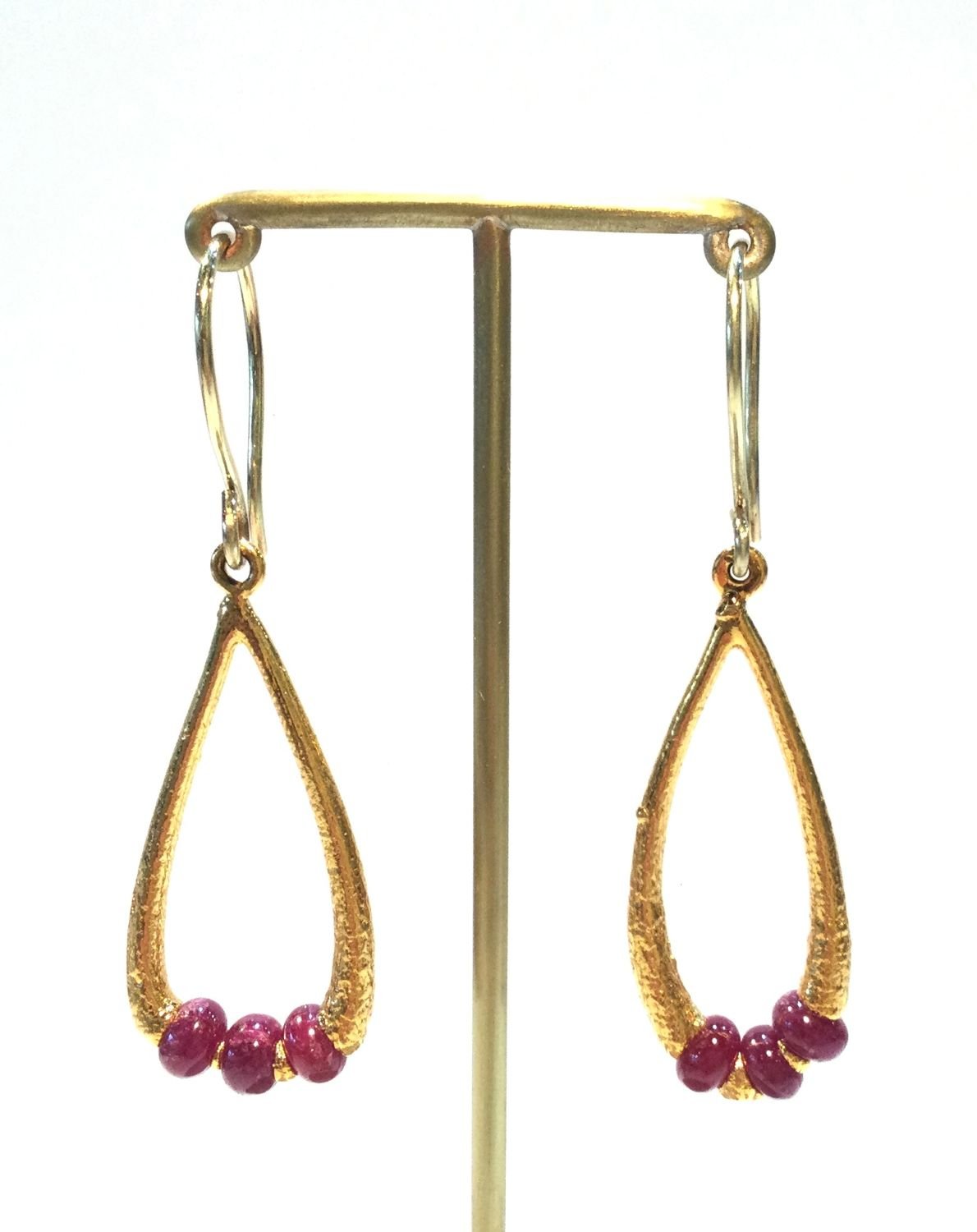 Orbus Cage Earring (#277), 2010, thick electroformed 24k gold, rubies, 18k gold ear wire, fusion welded stainless steel, electroformed copper, 2 x .5 inches (5 x 1.5 cm), $800 Cdn.