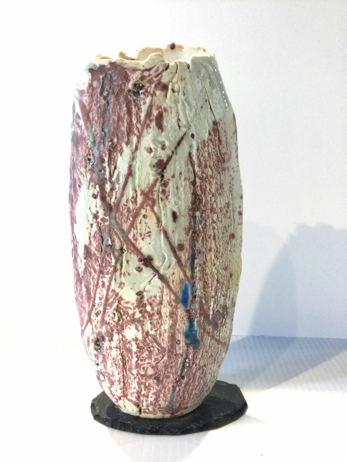 Snowy Mountain Inclusions XXVI-IV, 2025, porcelain slab with slate base, 10.25 x 4.75 x 2 inches (26 x 12 x 5 cm), $480 Cdn.