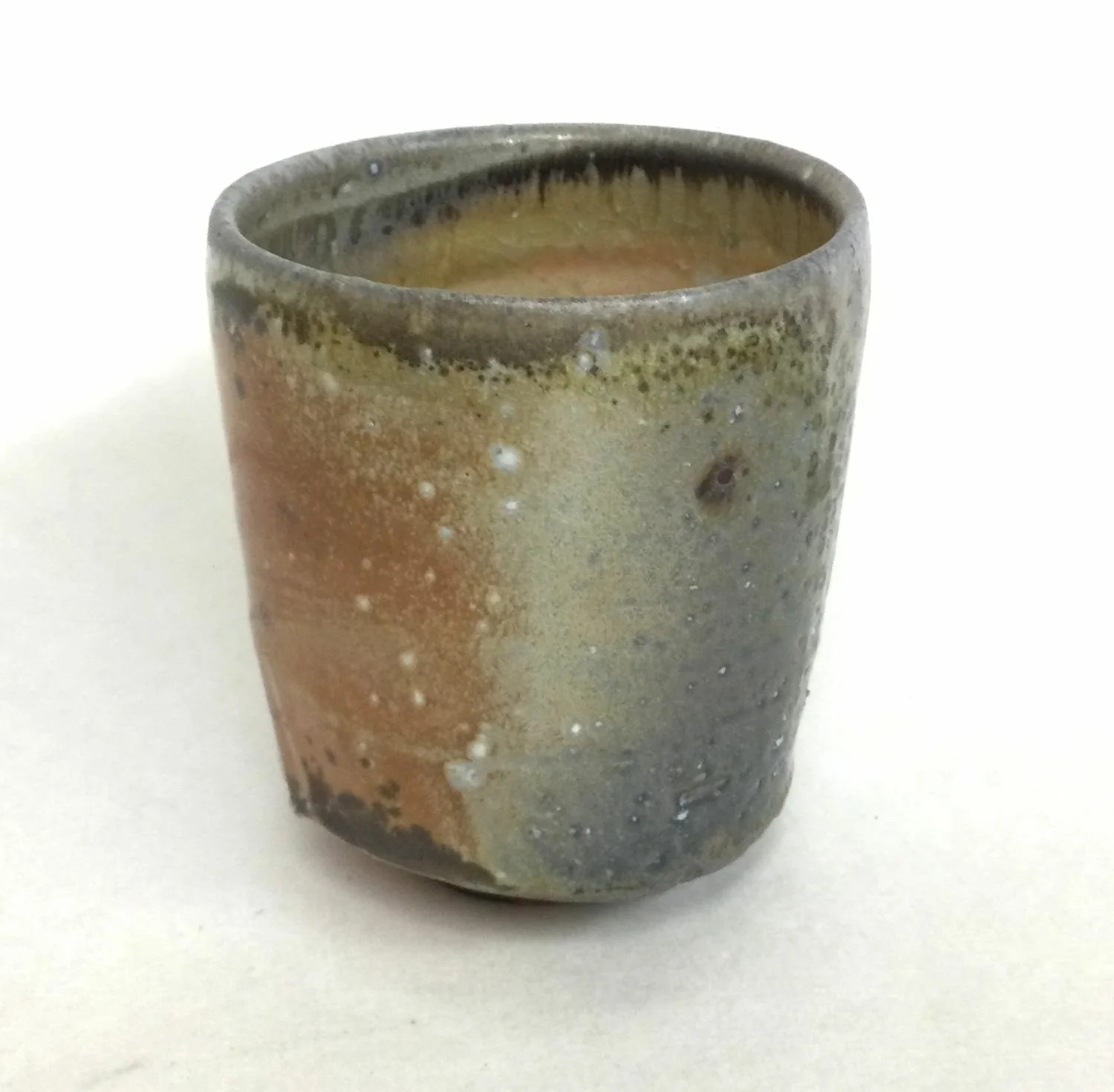 Atmospheric Fired Yunomi Cup With Turned Foot (#25.5), 2025, woodfired porcelain, ideal for cradling in your hands to savour the warmth and aroma of your drink; if it is too hot to handle it is too hot to drink, 4 x 3.5 inches (10 x 9 cm) $70 Cdn.
