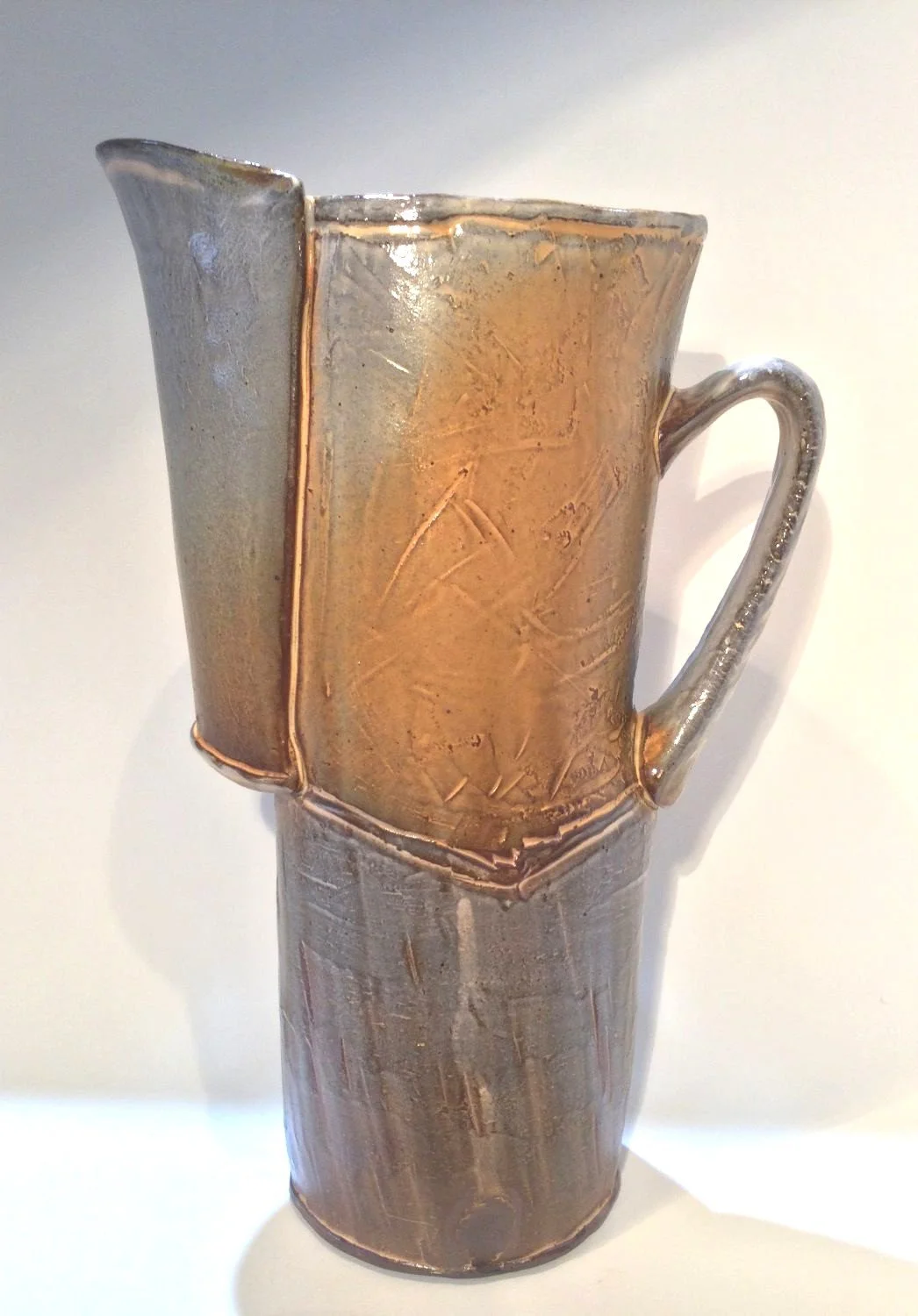Confluence Pitcher (#26.2.2), 2026, low soda-fired earthenware, 10.5 x 3.75 x 7.25 inches (27 x 9.5 x 18.5 cm), $280 Cdn.
