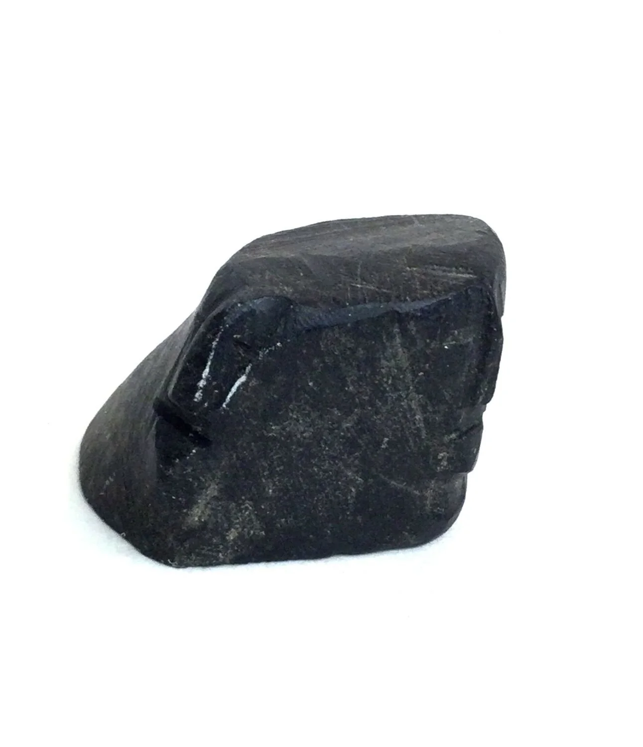 Lucy Tasseor Tutsweetok ᓗᓯ ᑕᓯᐅ ᑎᓯᑕ (1934-2012) Arviat/Eskimo Point ᐊᕐᕕᐊᑦ , Faces (#25.11.57), c.1974, basalt, 1 x 1.5 x 1 inches (2.5 x 4 x 2.5 cm), $475 Cdn.