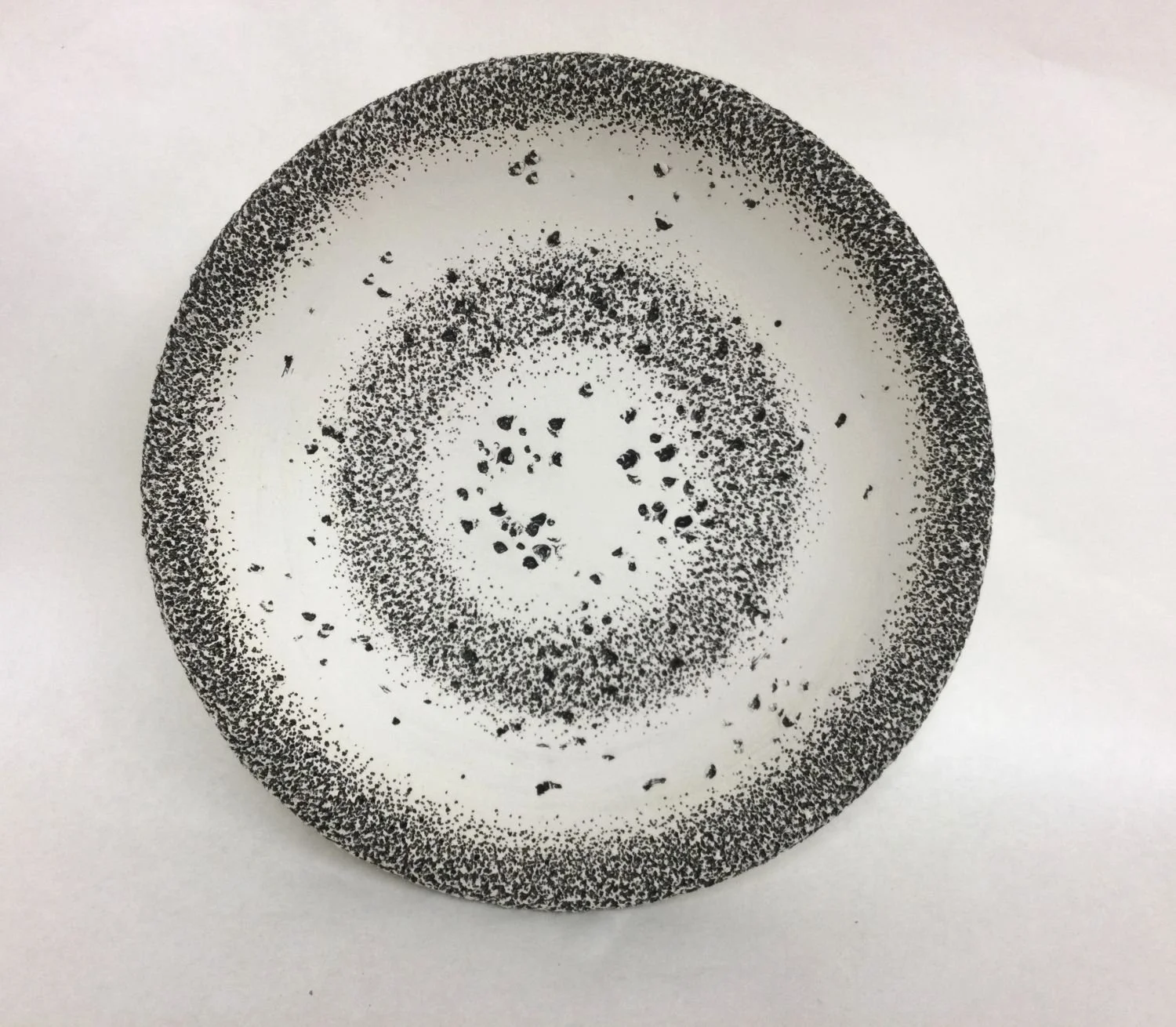 Heartbeat Series 3 (#25.9.3), 2023, earthenware clay, black glaze wall hanging, 12.25 X 3" (31 X 7.5 cm), $450 Cdn.