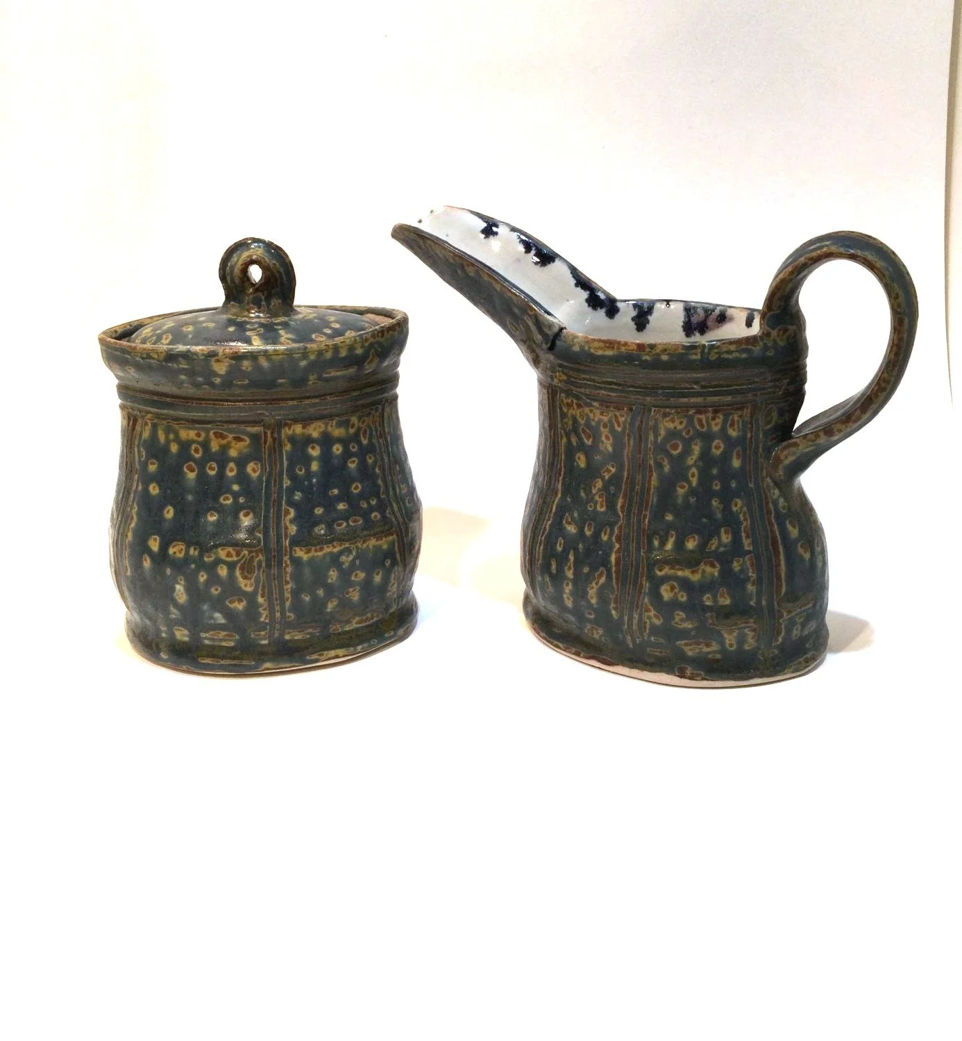 Reduction Fired Cream and Sugar Set (#26.6.29), 2026, reduction fired porcelain, 5.5 inches (14 cm) high, $90 Cdn (2 pce set)
